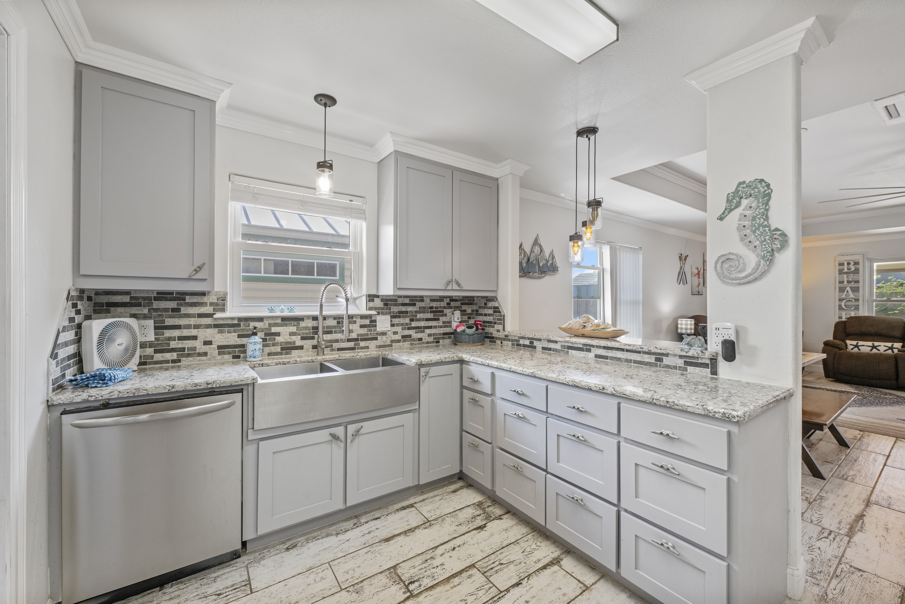 Bright, Welcoming Kitchen Opens to Social Living Spaces 