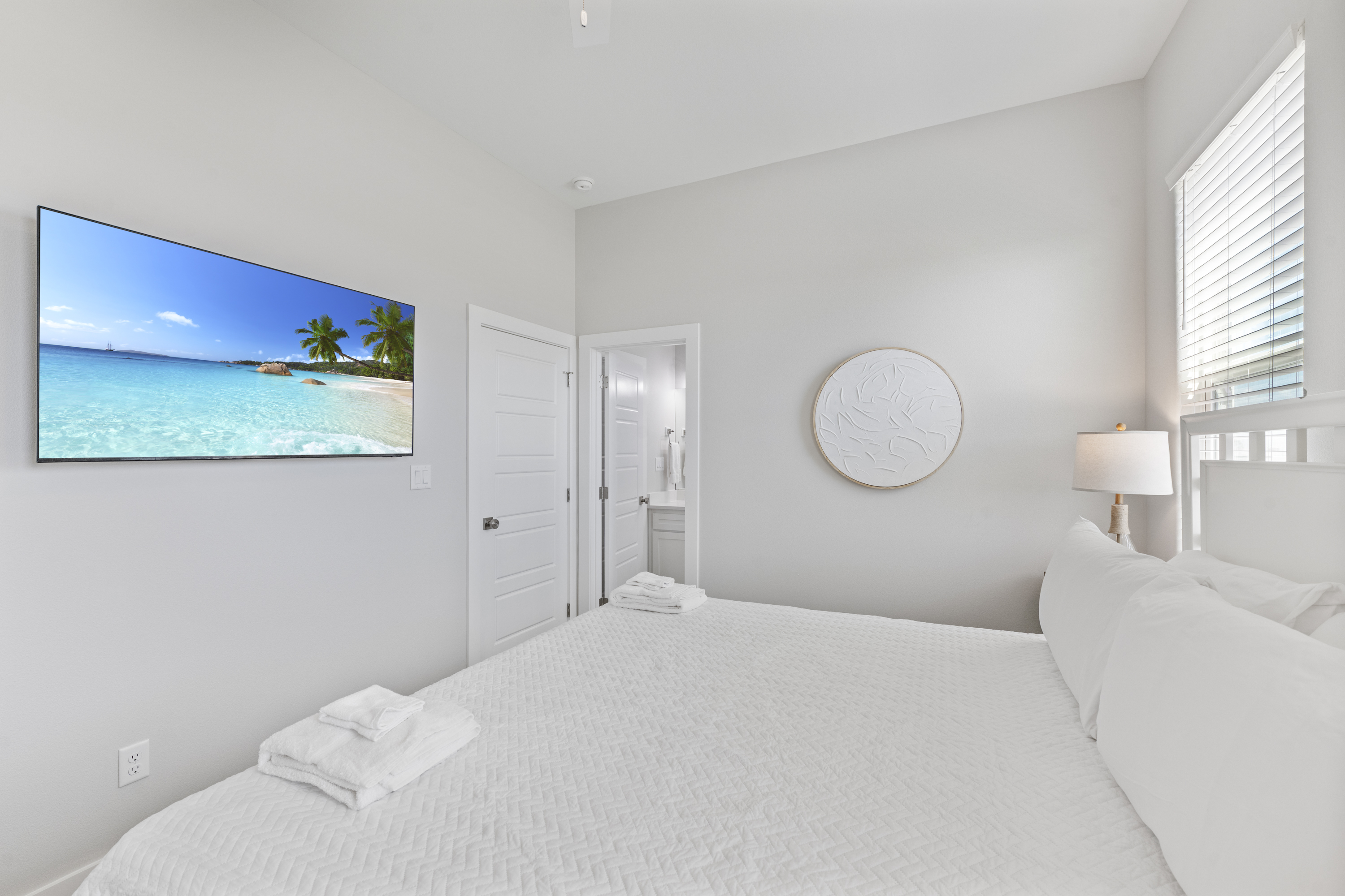 Mounted TV for Entertainment; 3rd Floor King Bedroom with Shared Guest Bathroom where elegance meets tranquility 