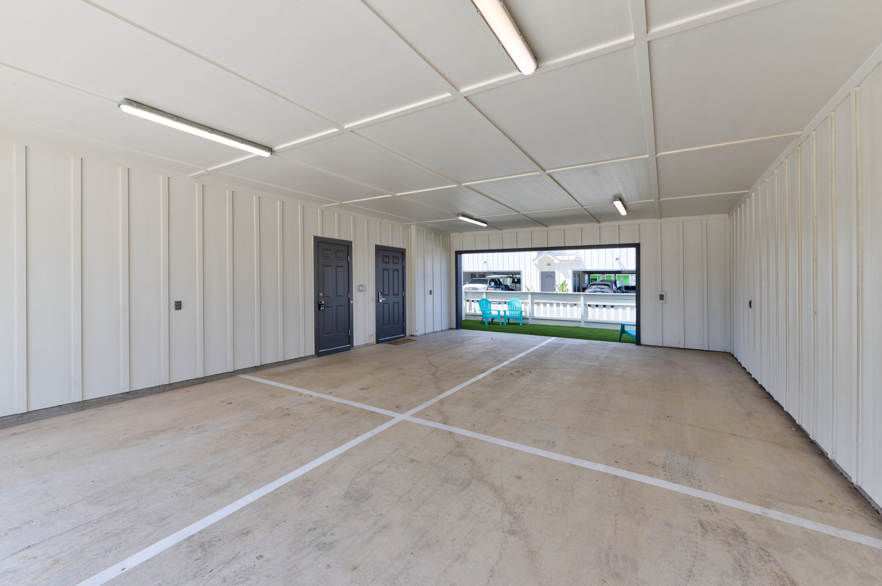 Spacious carport that will accommodate up to four midsize cars. 