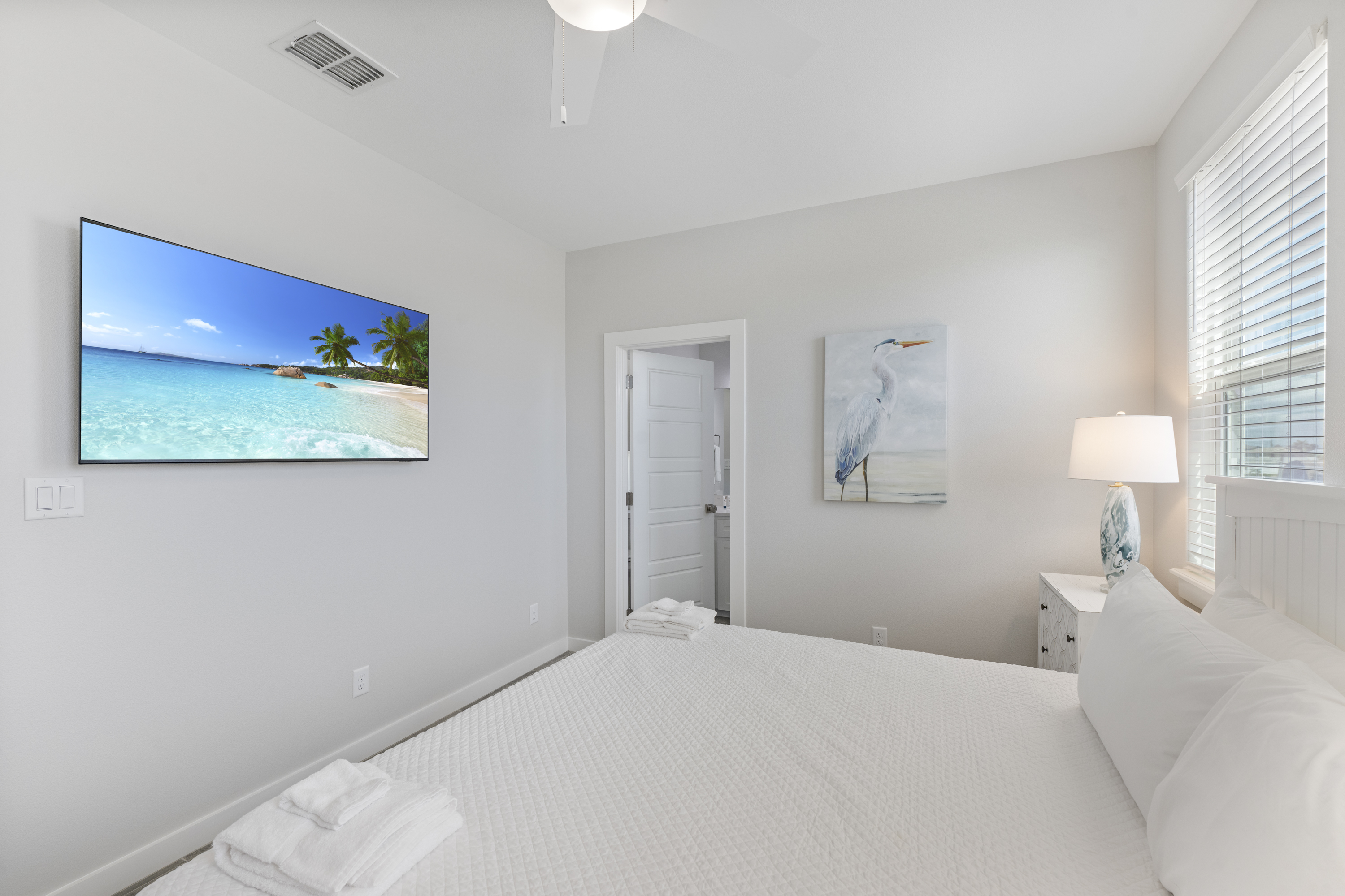 Enhance the relaxing seaside vibe in this 2nd Floor Primary King Suite with Mounted TV to Enjoy 