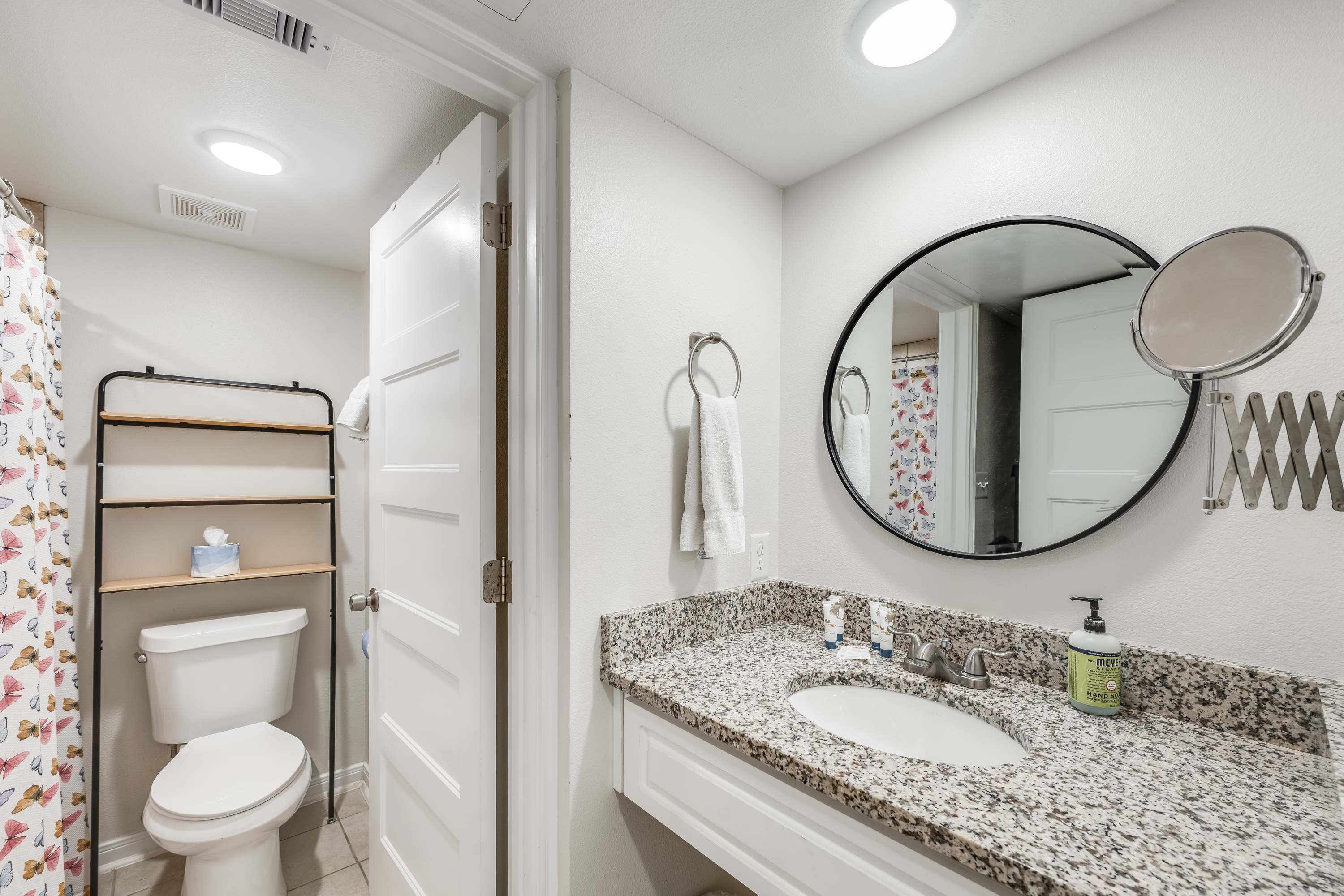 Enjoy plenty of counter space and large mirrors for your daily routine.