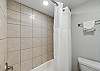 first bathroom with tub/shower combo
