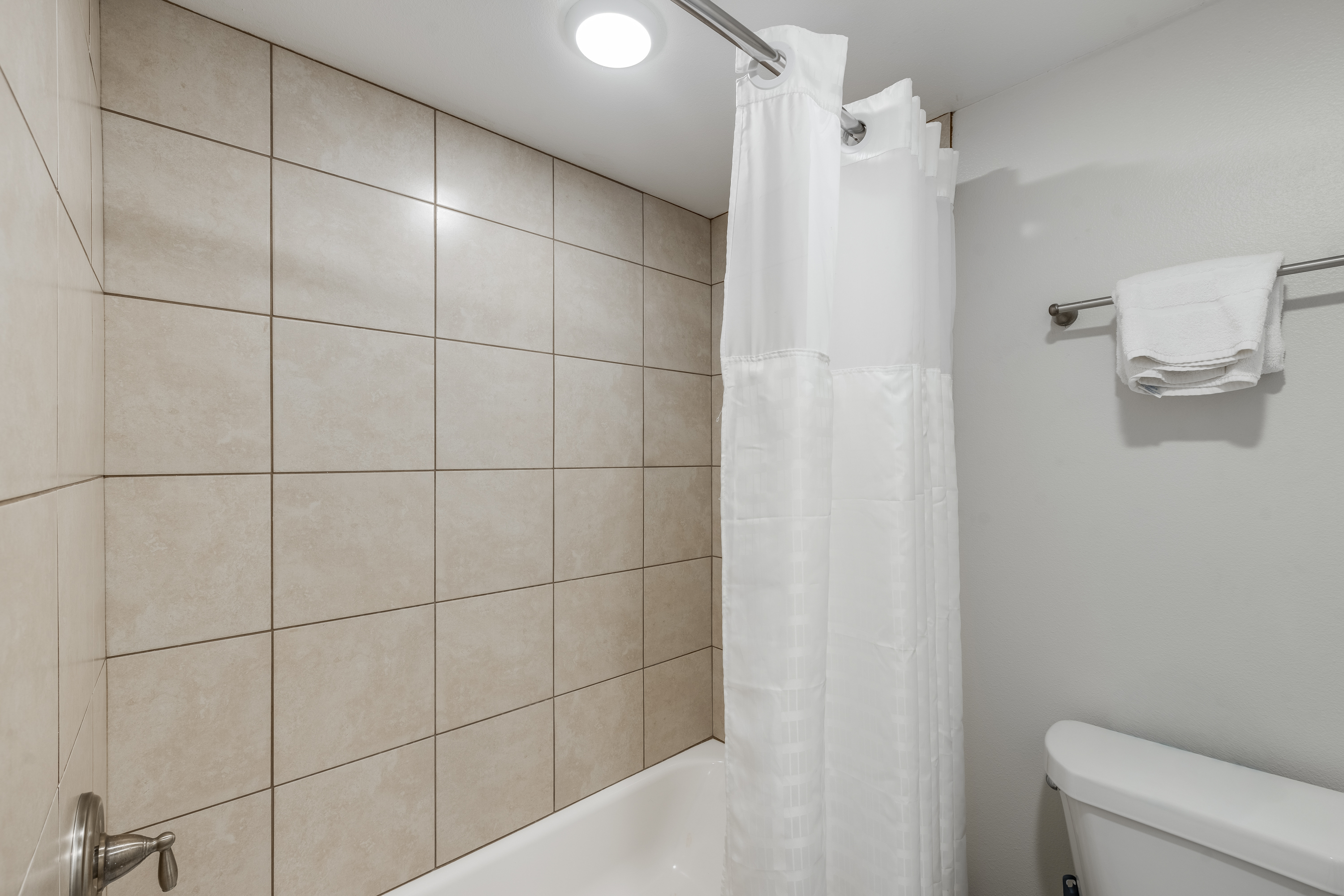 Tub or shower? The first bathroom has both with a convenient combo!