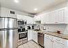 Updated kitchen with stainless appliances.