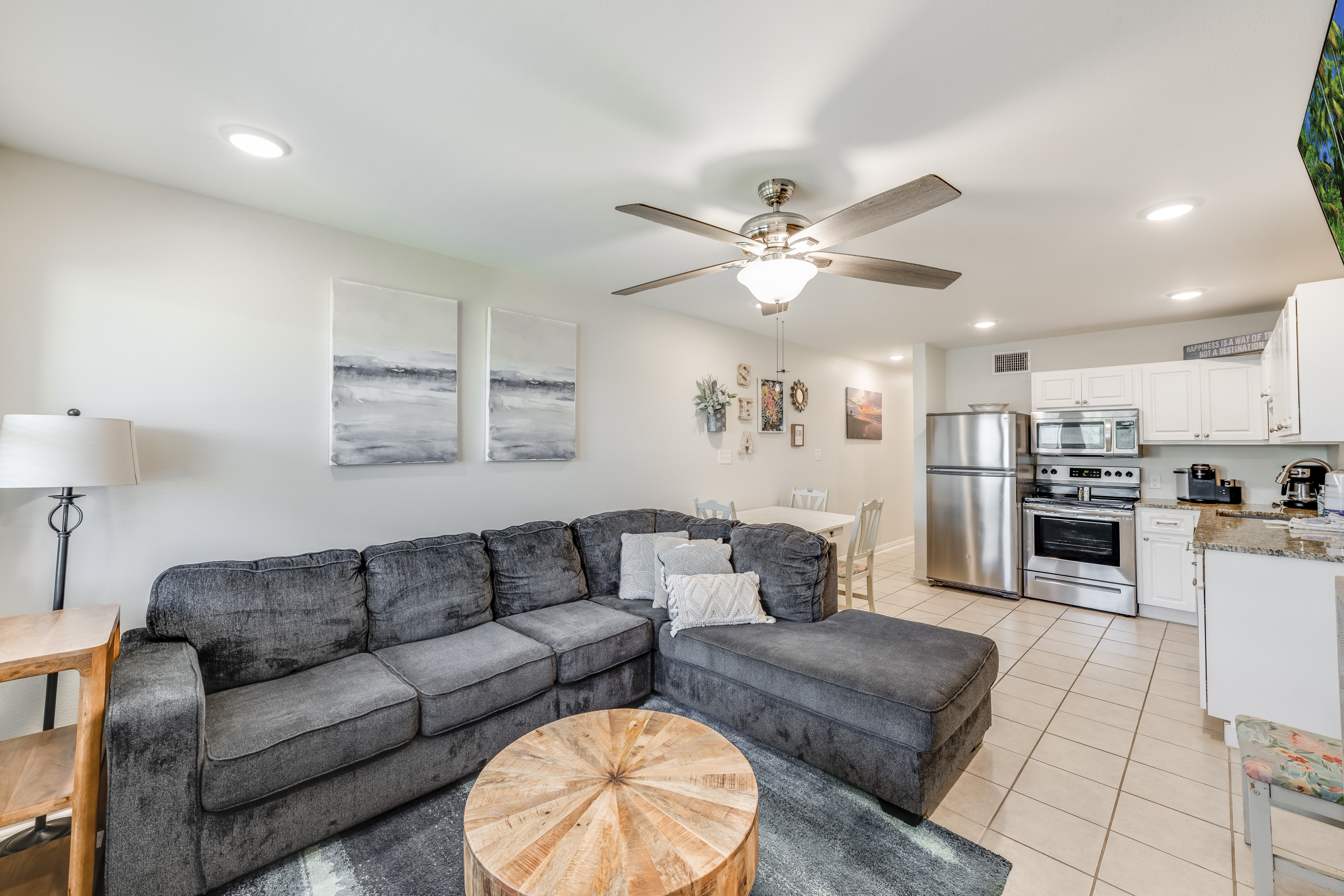 Relax and recharge in a space filled with comfy seating and beachy details, perfect for seaside unwindings.