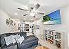 Spacious living area with a sofa sleeper and flat screen TV