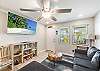 Spacious living area with a sofa sleeper and flat screen TV