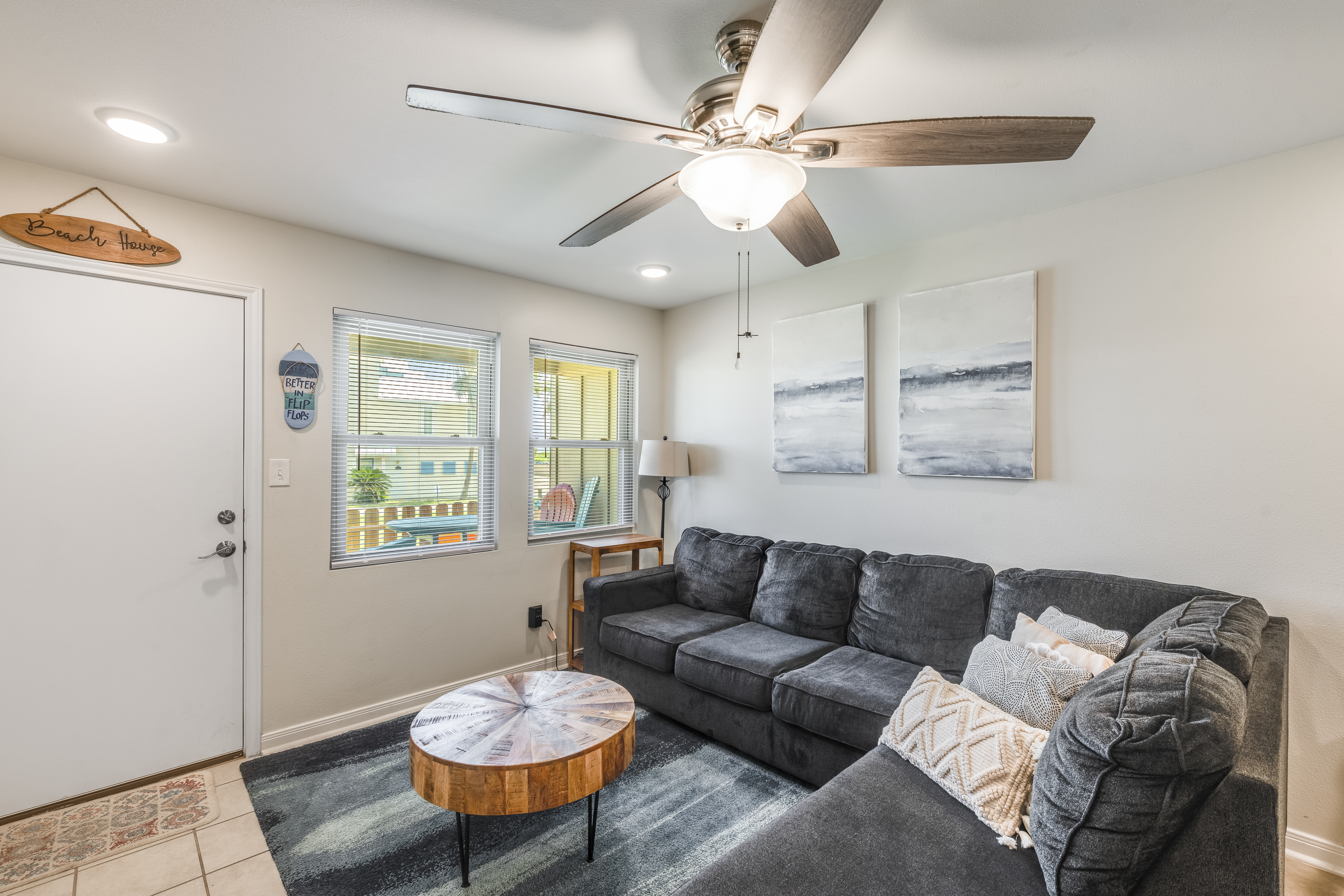 Comfort meets style in this lounge-friendly living room with a sleeper sofa for extra guests!