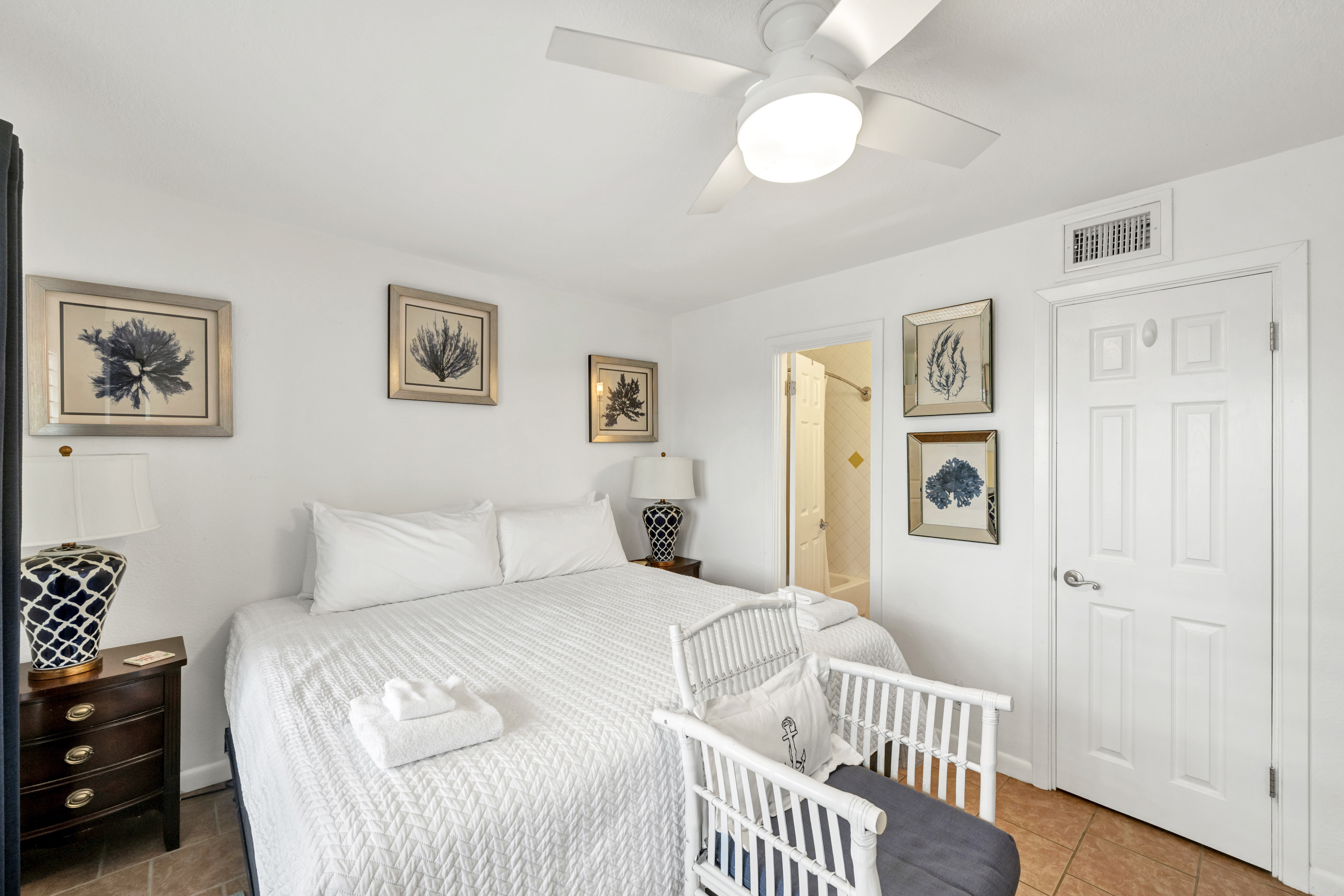 Main bedroom featuring a luxurious king-size bed and a private ensuite bathroom