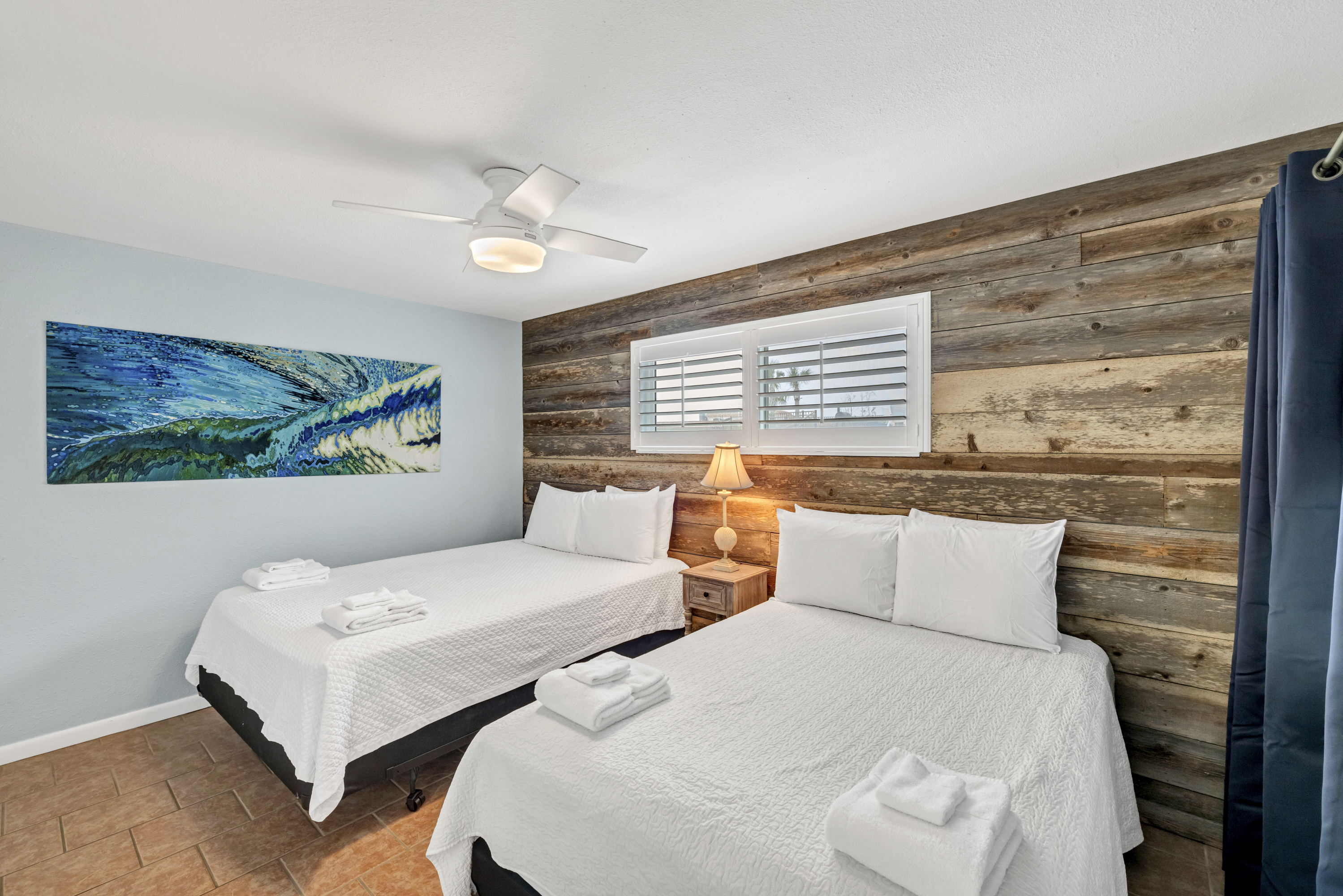 Inviting second bedroom featuring a comfortable Queen bed and full size bed, perfect for families or groups