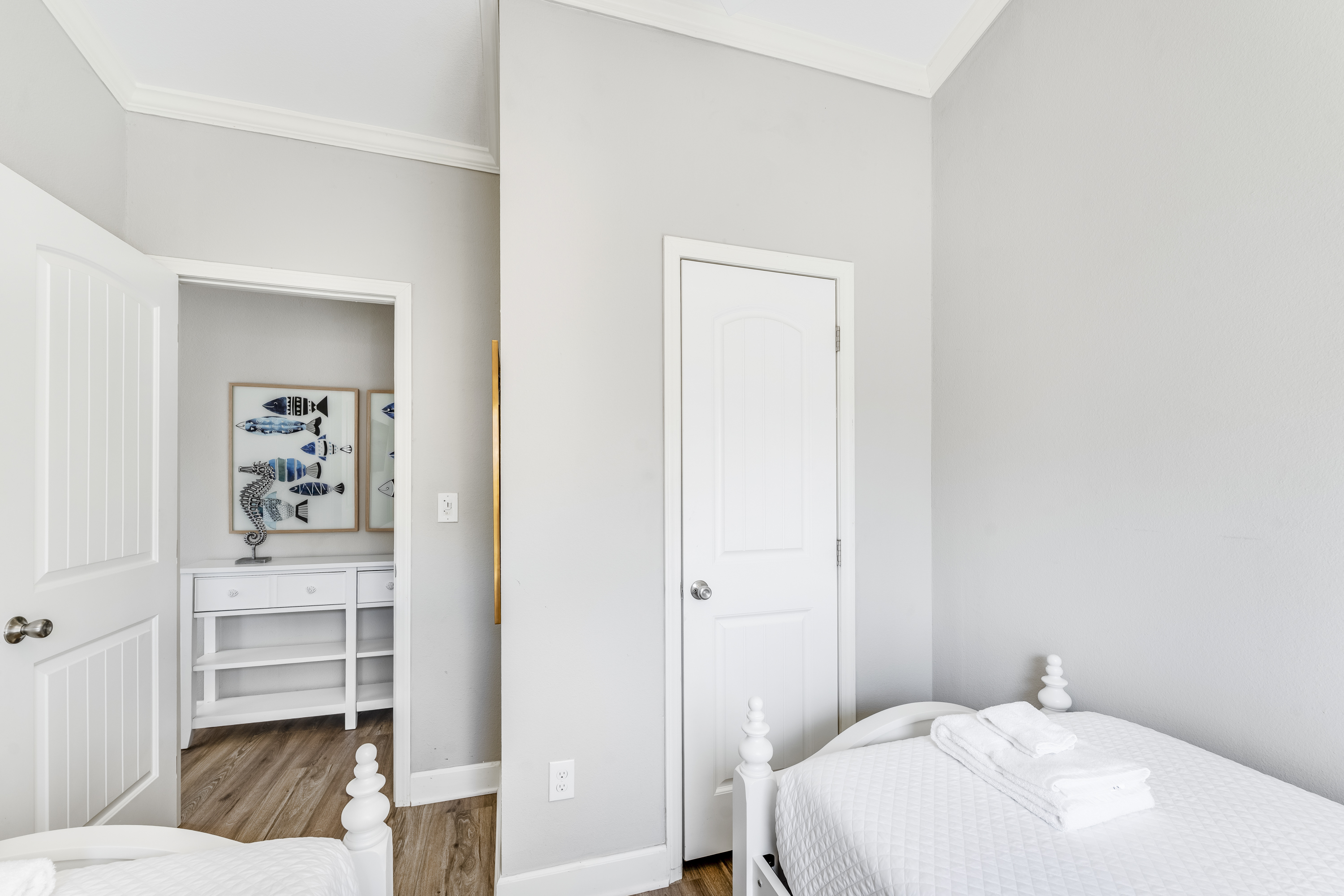Sunshine and comfort collide! This light-filled guest bedroom is the perfect spot to relax and recharge