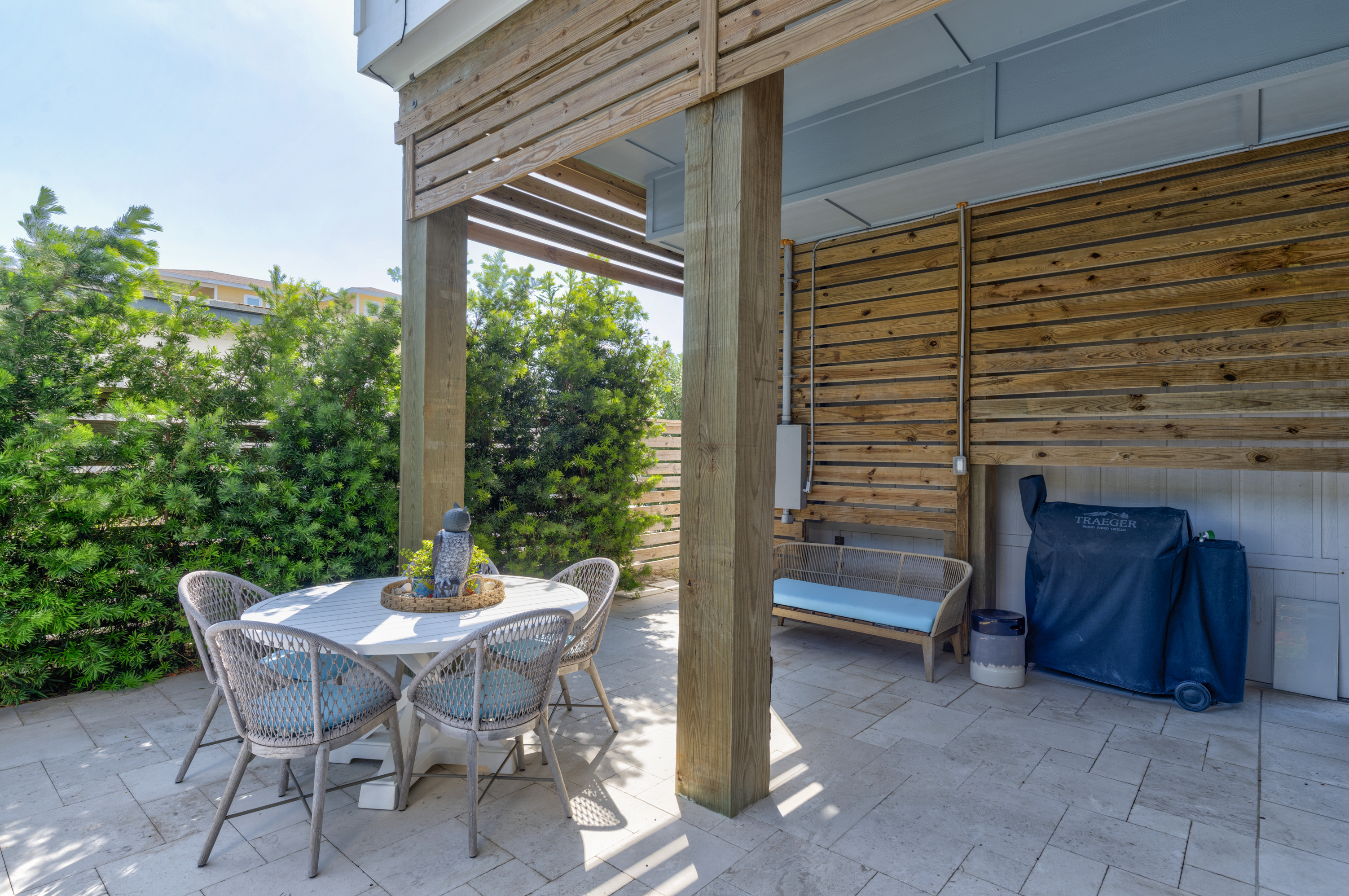 The picnic table by the pool offers a shaded spot to enjoy meals, snacks, or simply relax together after a refreshing swim