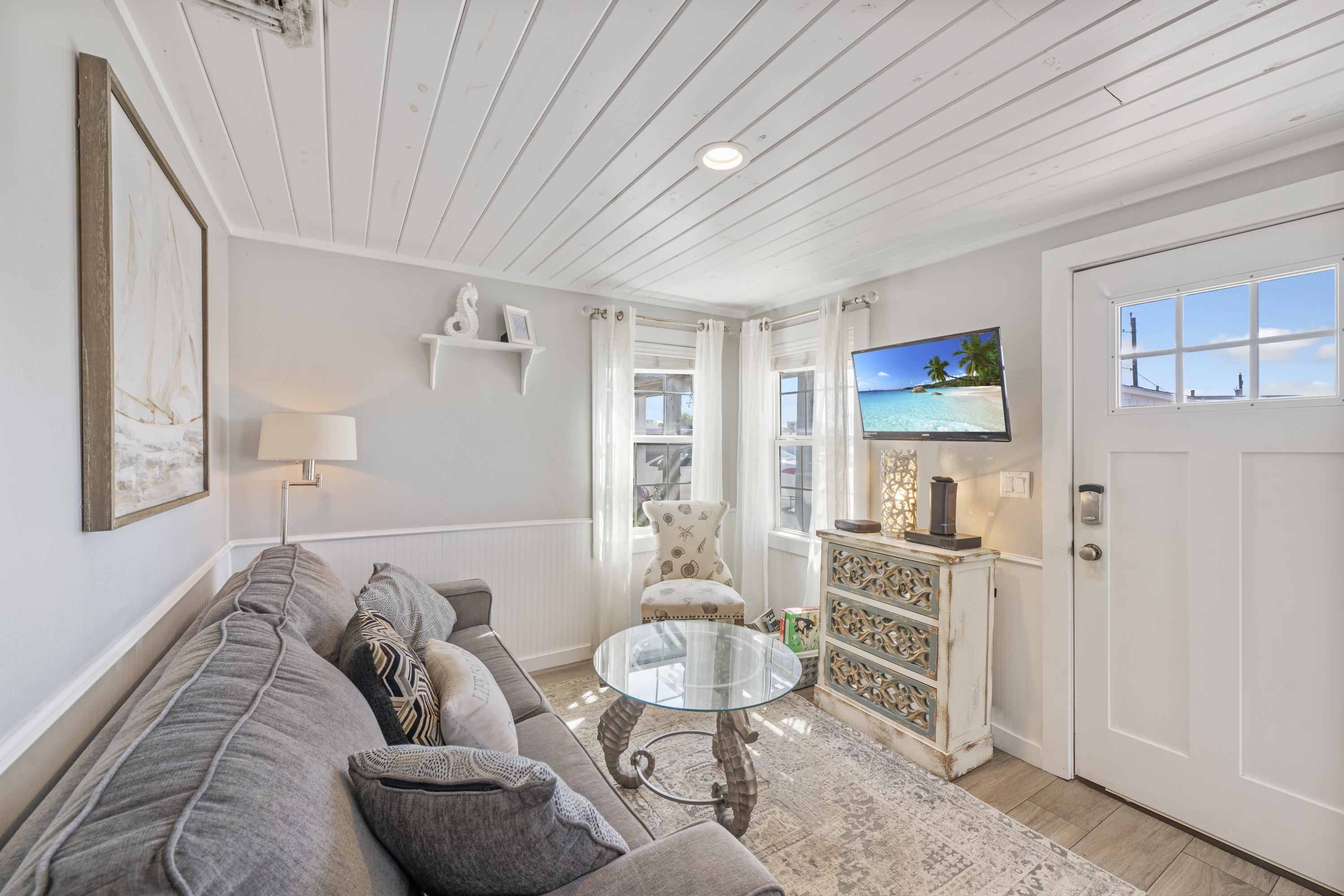 Gather here for good times featuring plush seating and a flat screen TV