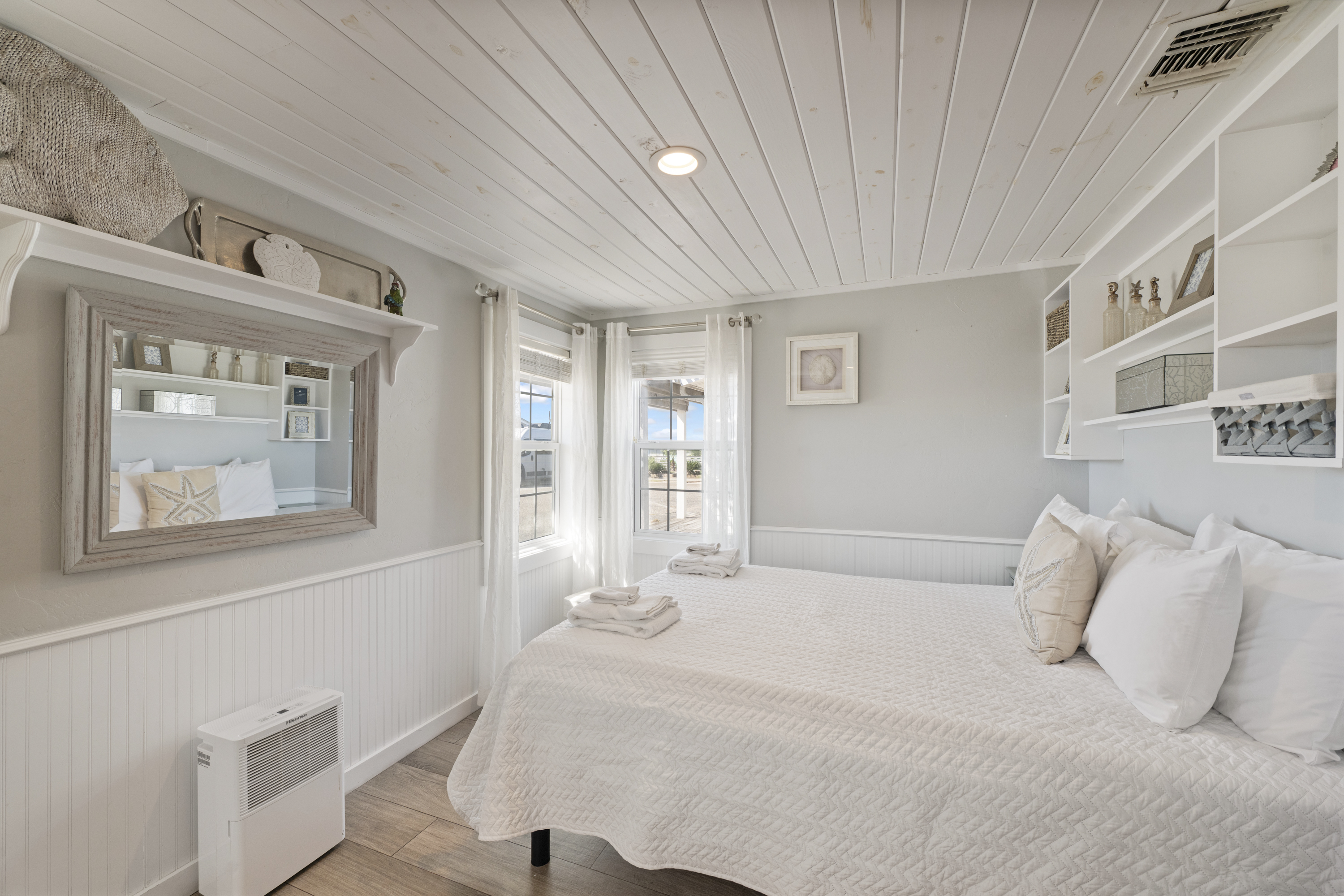 Stretch out, relax, and let the queen bed cradle you