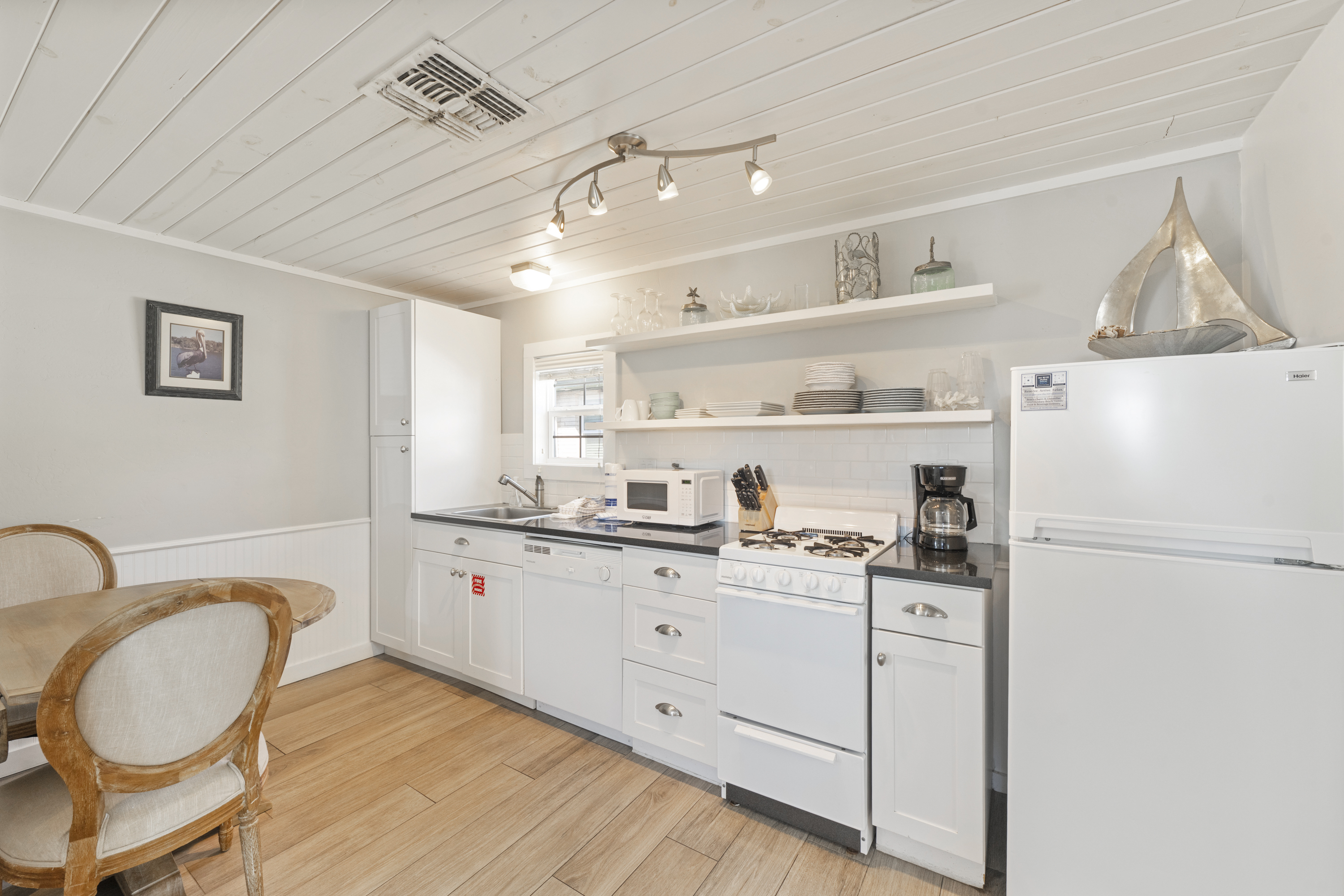 Fully equipped kitchen with modern essentials featuring a drip coffee maker