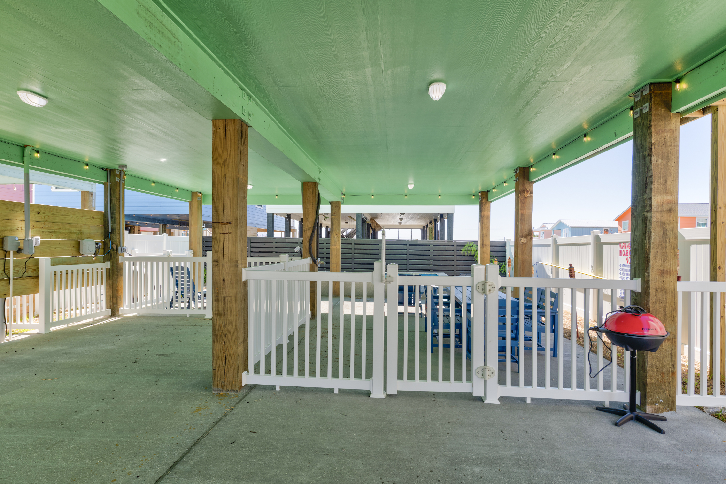 Sizzle up a family feast while little ones play safely in the fenced pool area