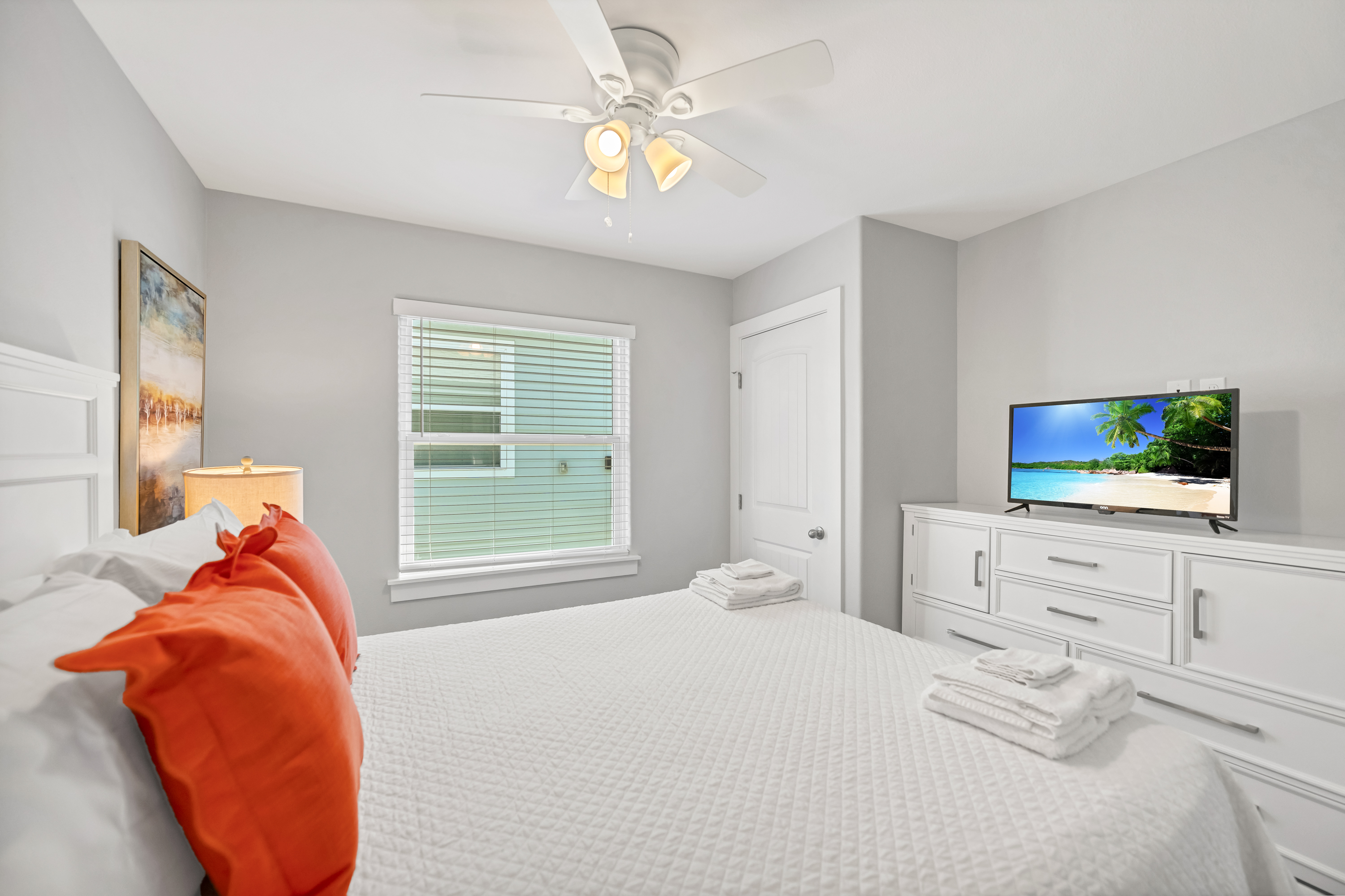 Experience tranquility and comfort in this 3rd cozy Queen bedroom featuring a TV and ample storage to unpack and unwind!