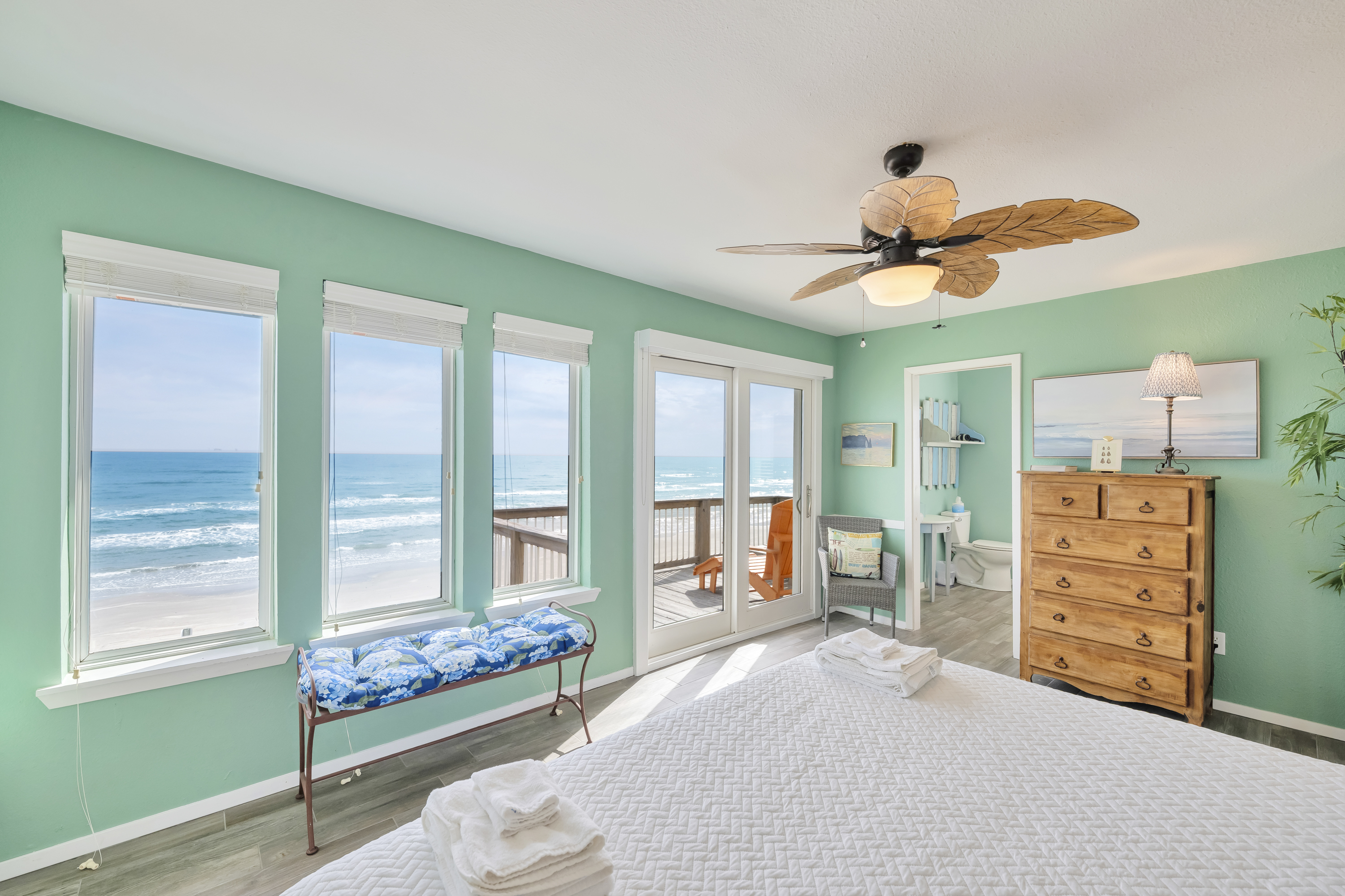 Wake Up to Wide-Open Ocean Views from the primary bedroom with a king size bed.