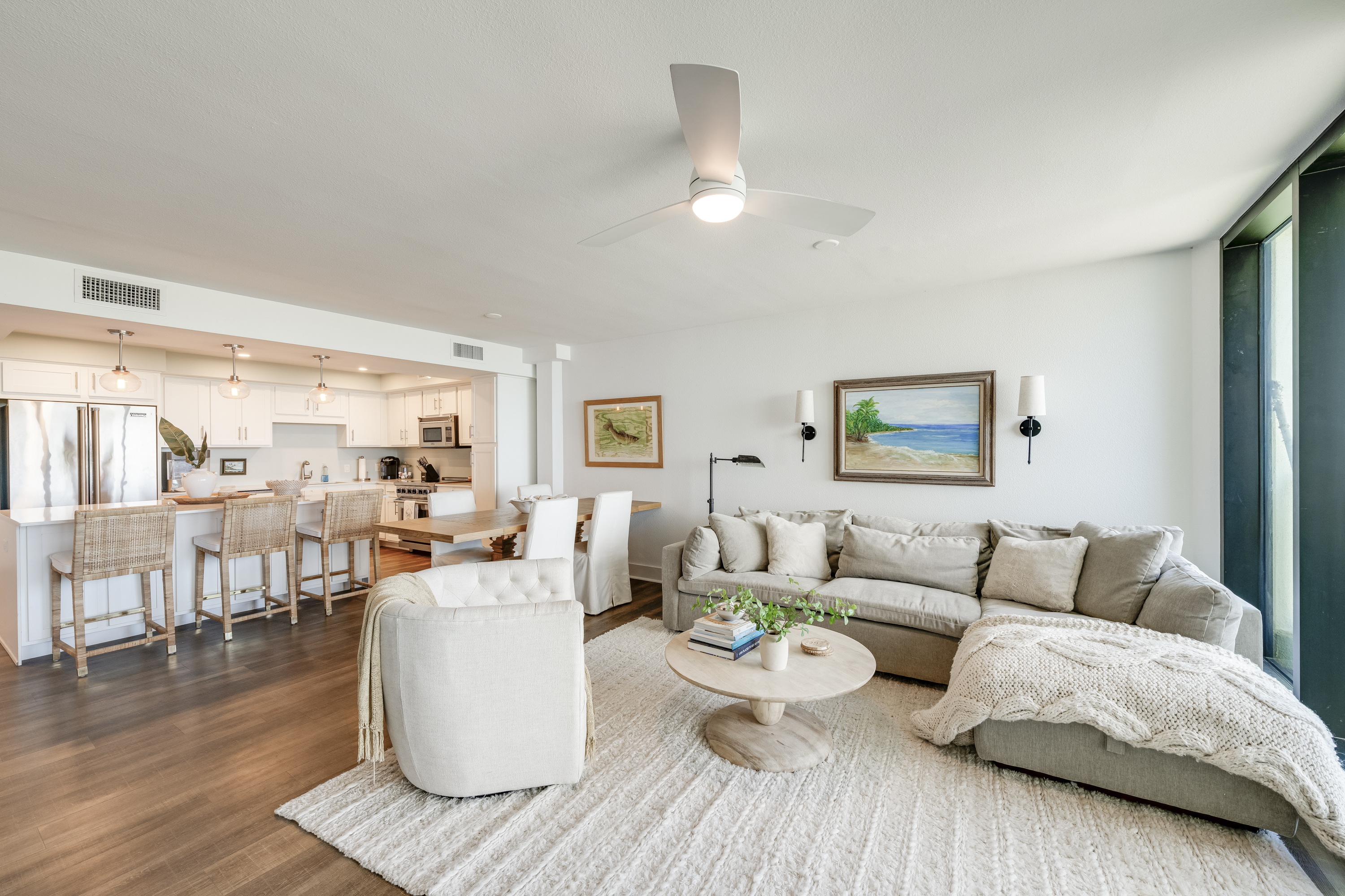 Spacious & Sunlit: Flowing Living, Dining, and Kitchen Areas 