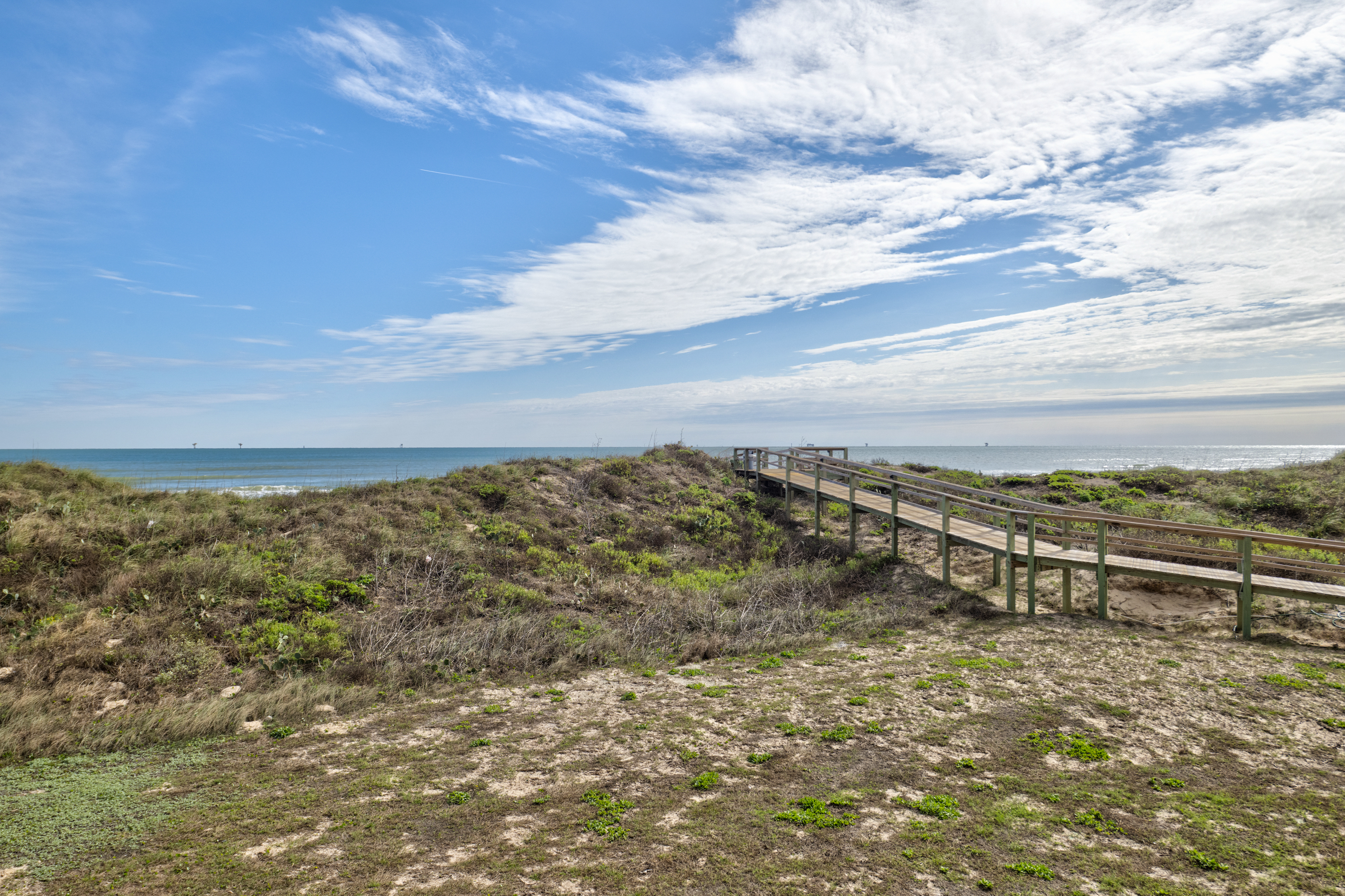 Family days and beach bonfires await beneath bright skies and blue tides.