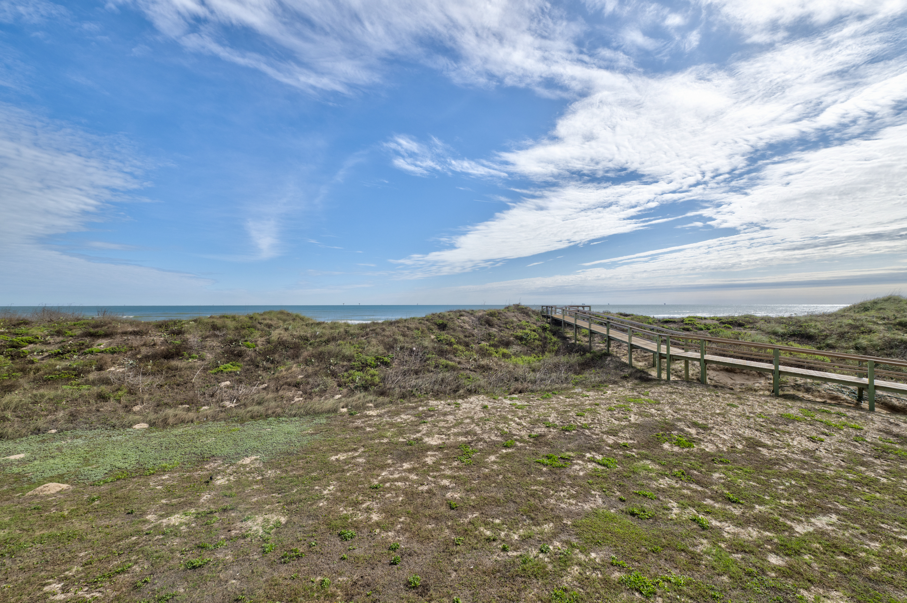 Enjoy a peaceful stroll while soaking in the serene dune views.