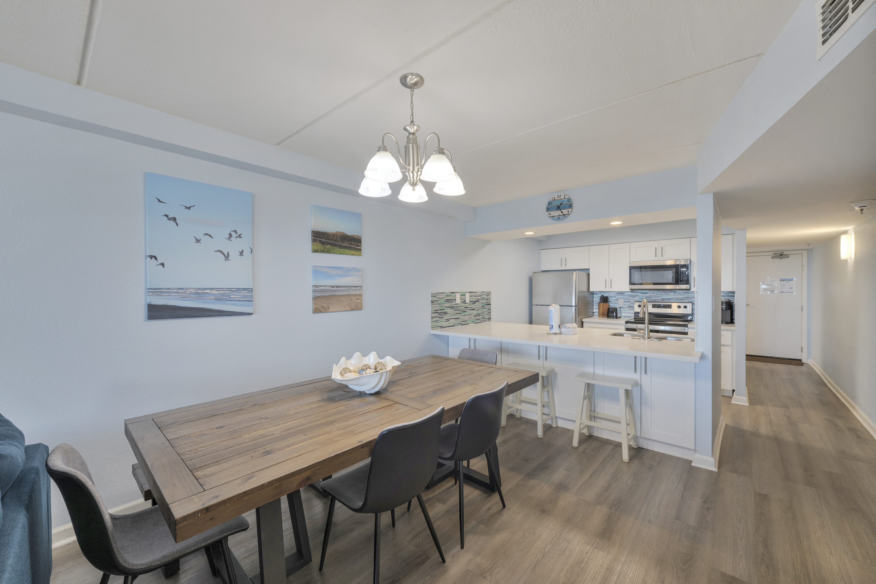 Enjoy a seamless flow between kitchen, dining, and living areas in a bright, airy setting.