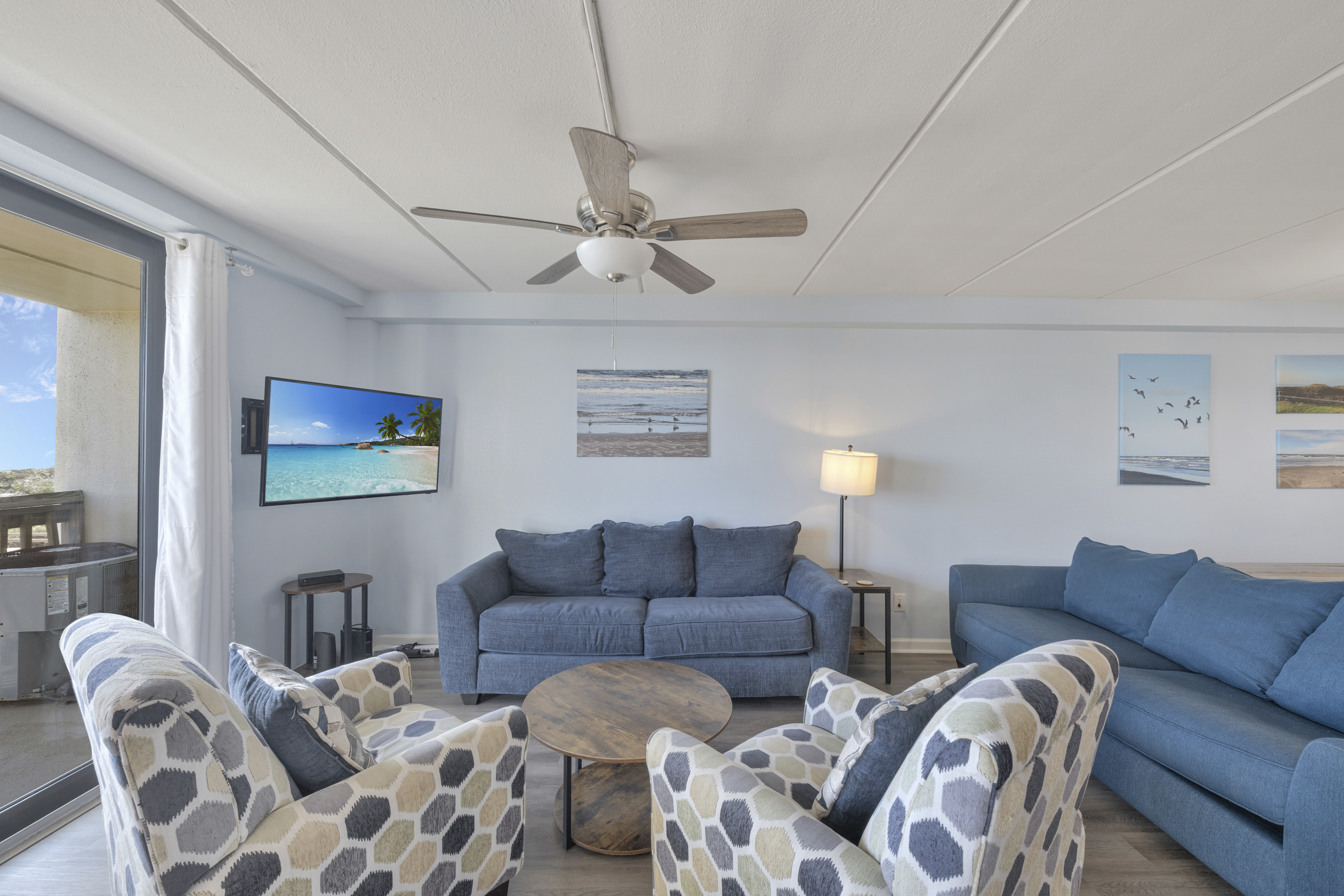 Soft, comfortable seating and ocean-inspired details create a welcoming space—perfect for unwinding after a day by the shore