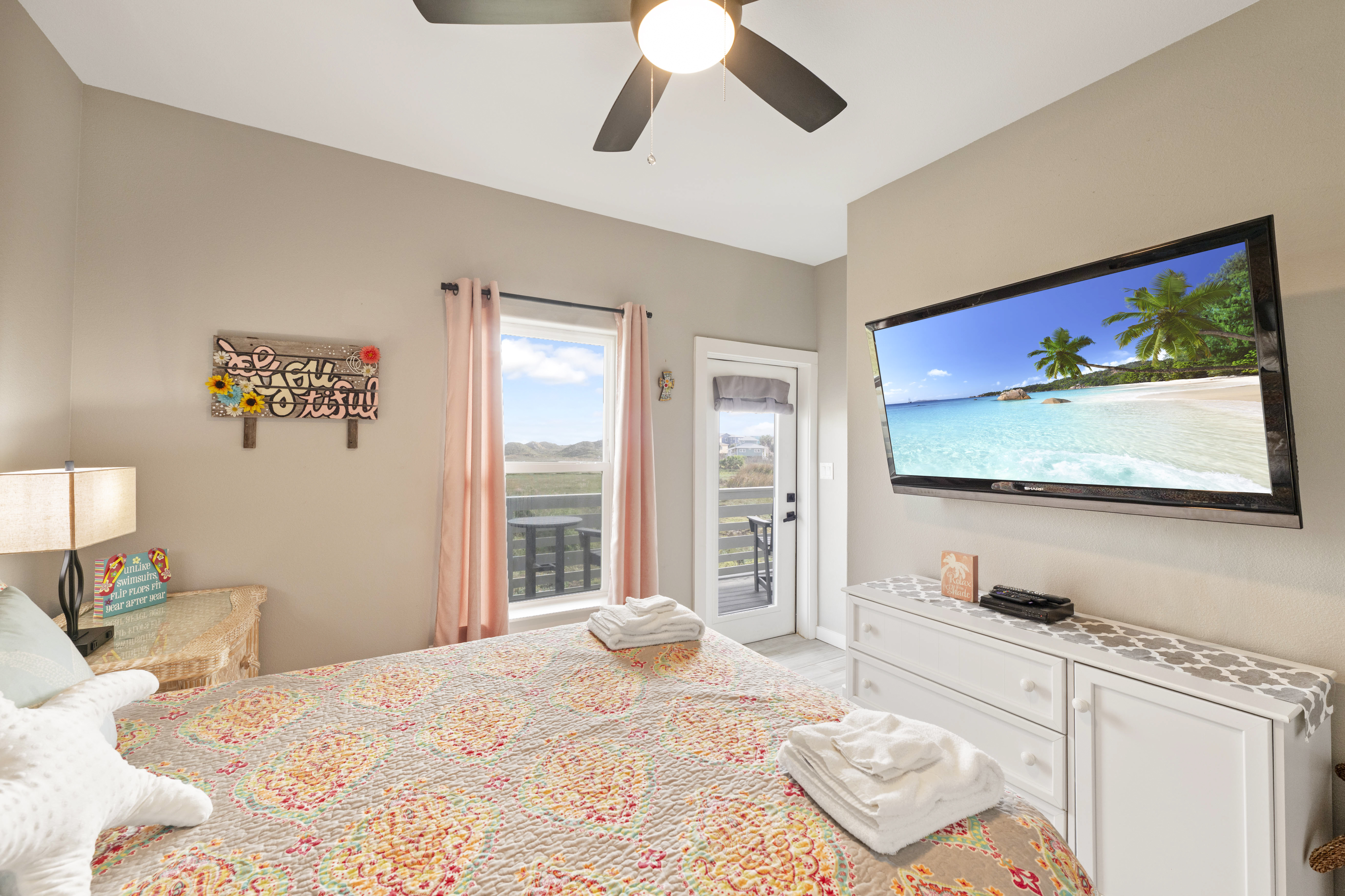 Kick back on the queen bed and catch your favorite shows on the mounted TV—vacation mode activated!