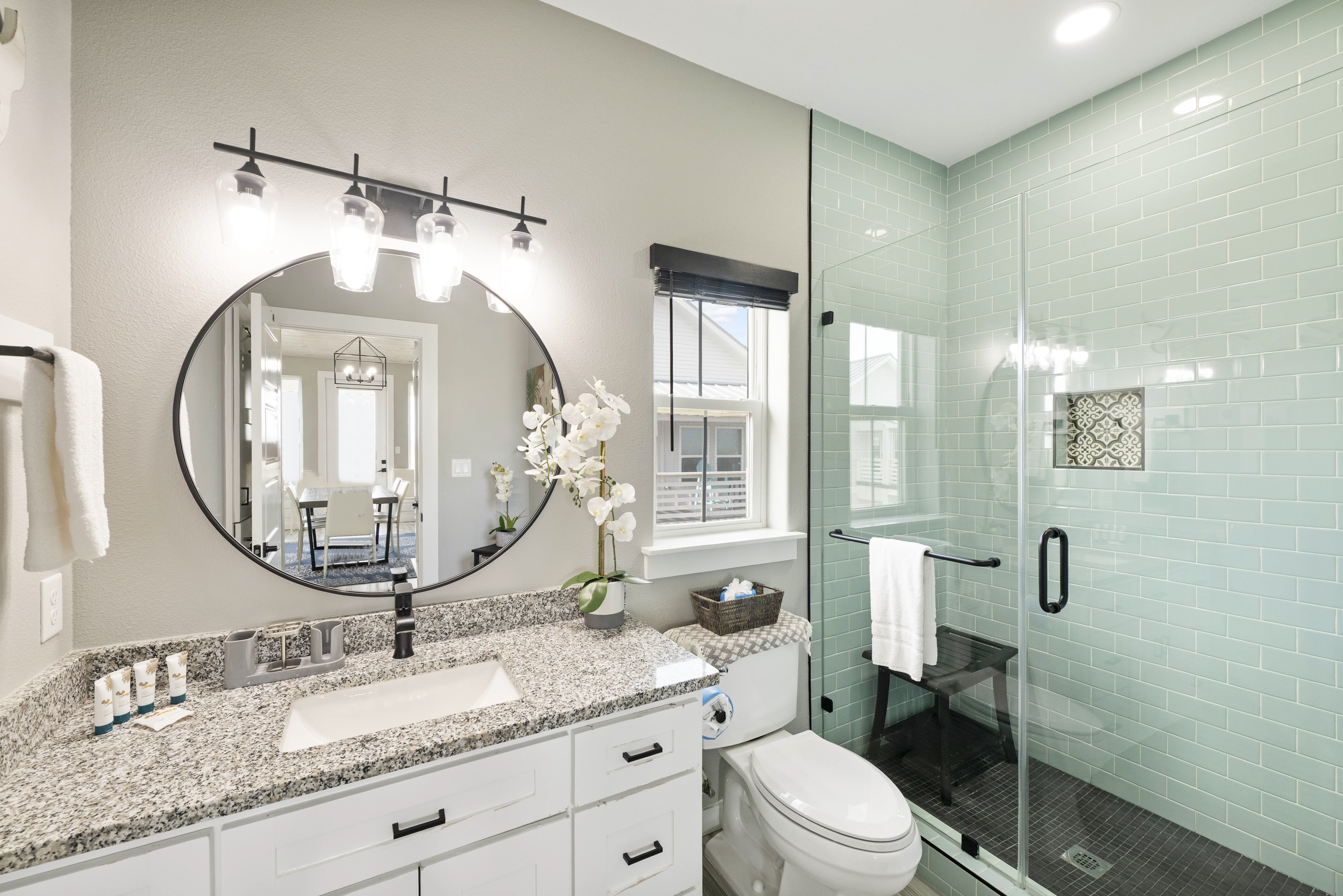 Splash, rinse, relax! This full bath with single vanity and walk-in shower with seat is your post-sun paradise.