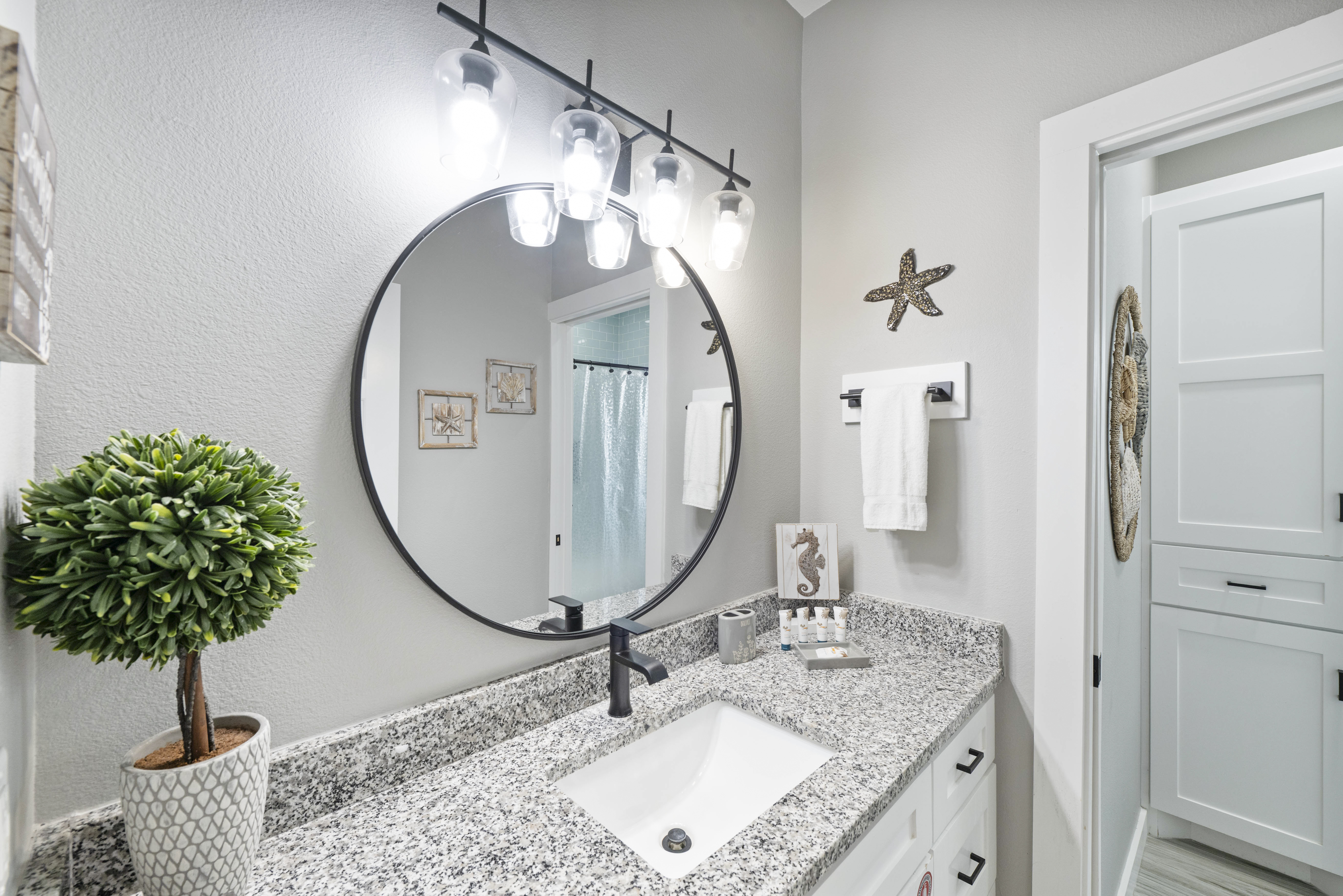 Refresh and unwind! This full bath features a spacious single vanity and walk-in shower