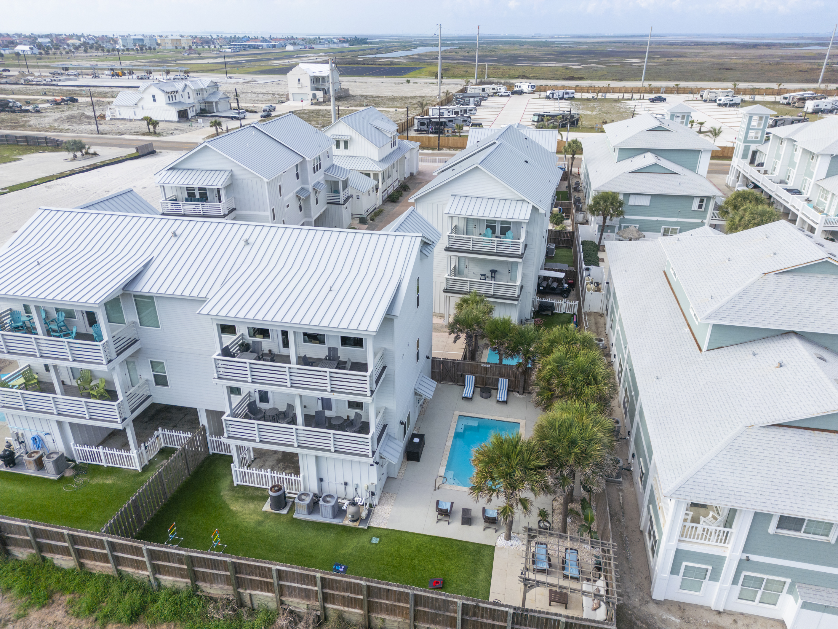 A picture-perfect backyard with everything you need for lounging, swimming, grilling, and games!