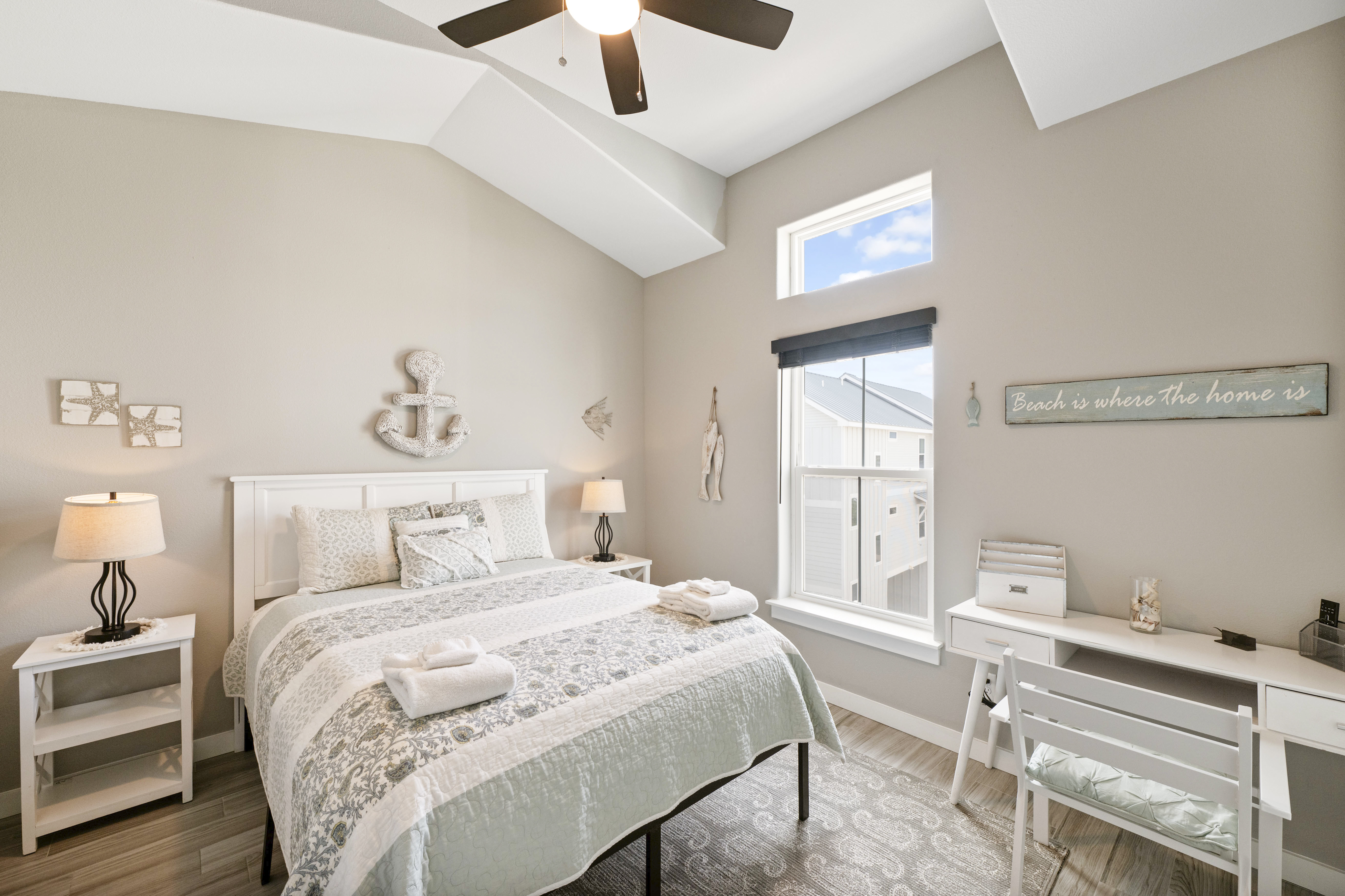 Rest, work, or plan your adventures—this queen bedroom doubles as a peaceful office space.