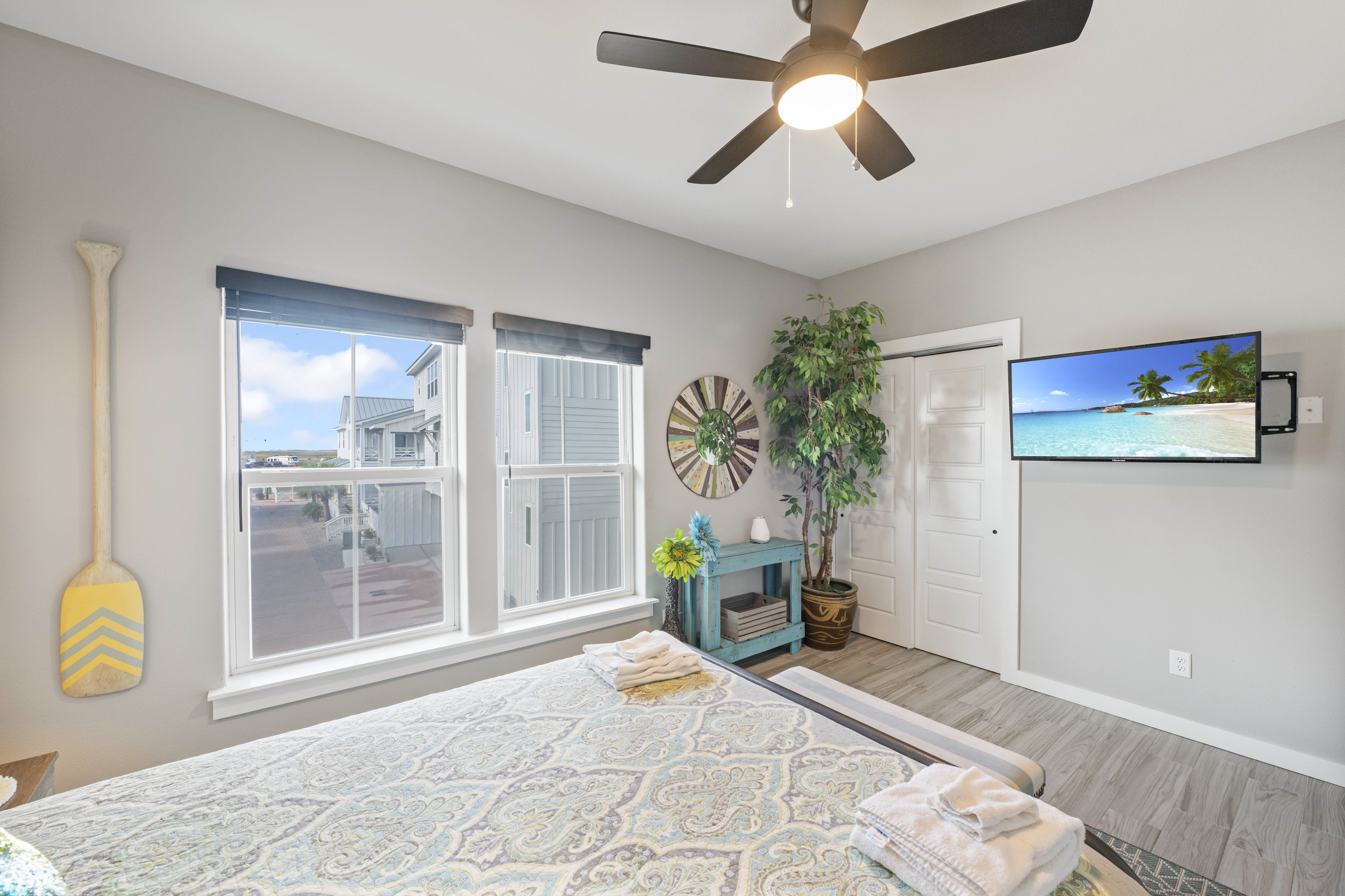 Queen-size retreat with mounted TV for laid-back comfort! 