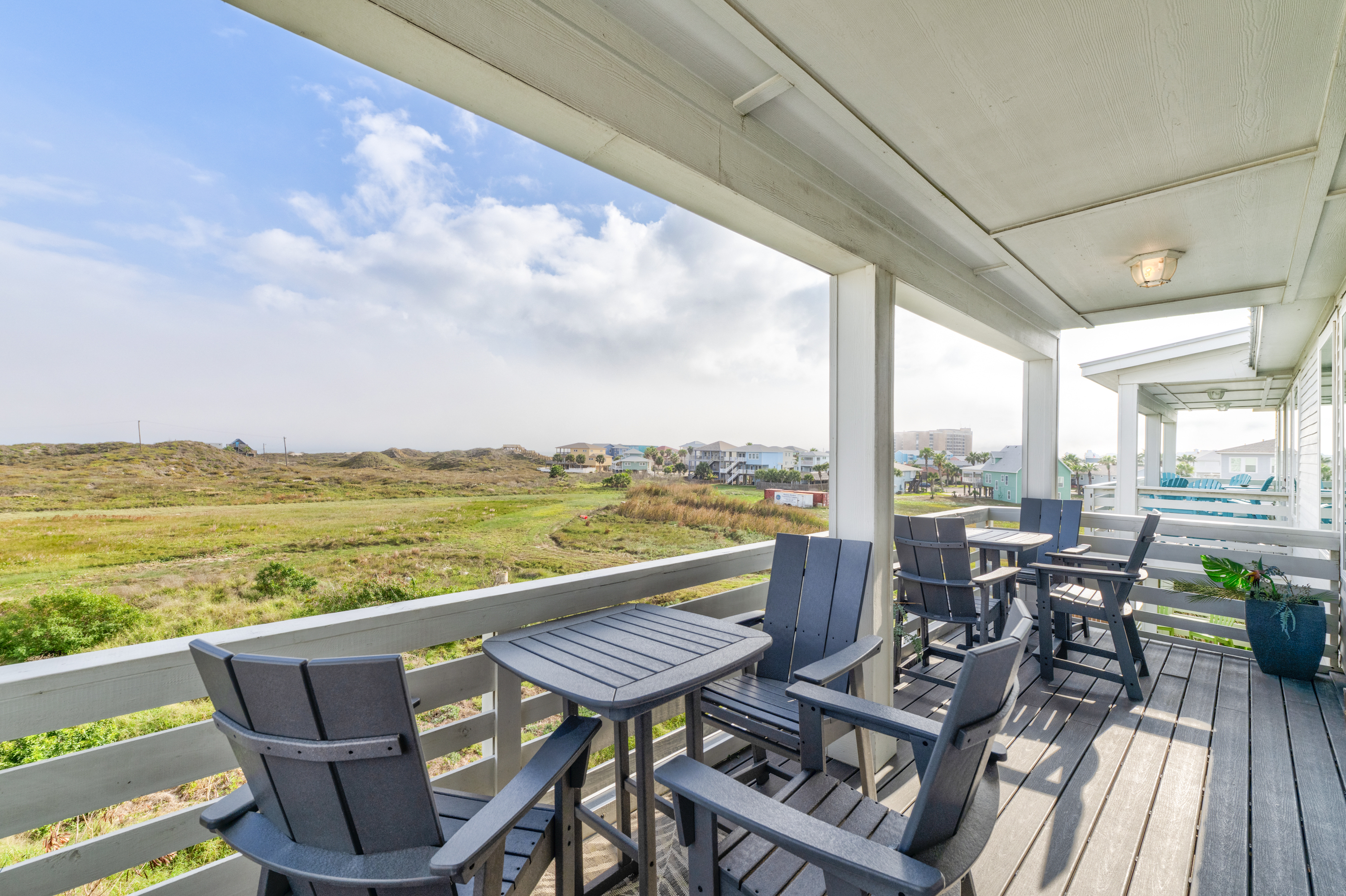 Enjoy drinks or meals on the generous balcony, overlooking the dunes with the Gulf just beyond.