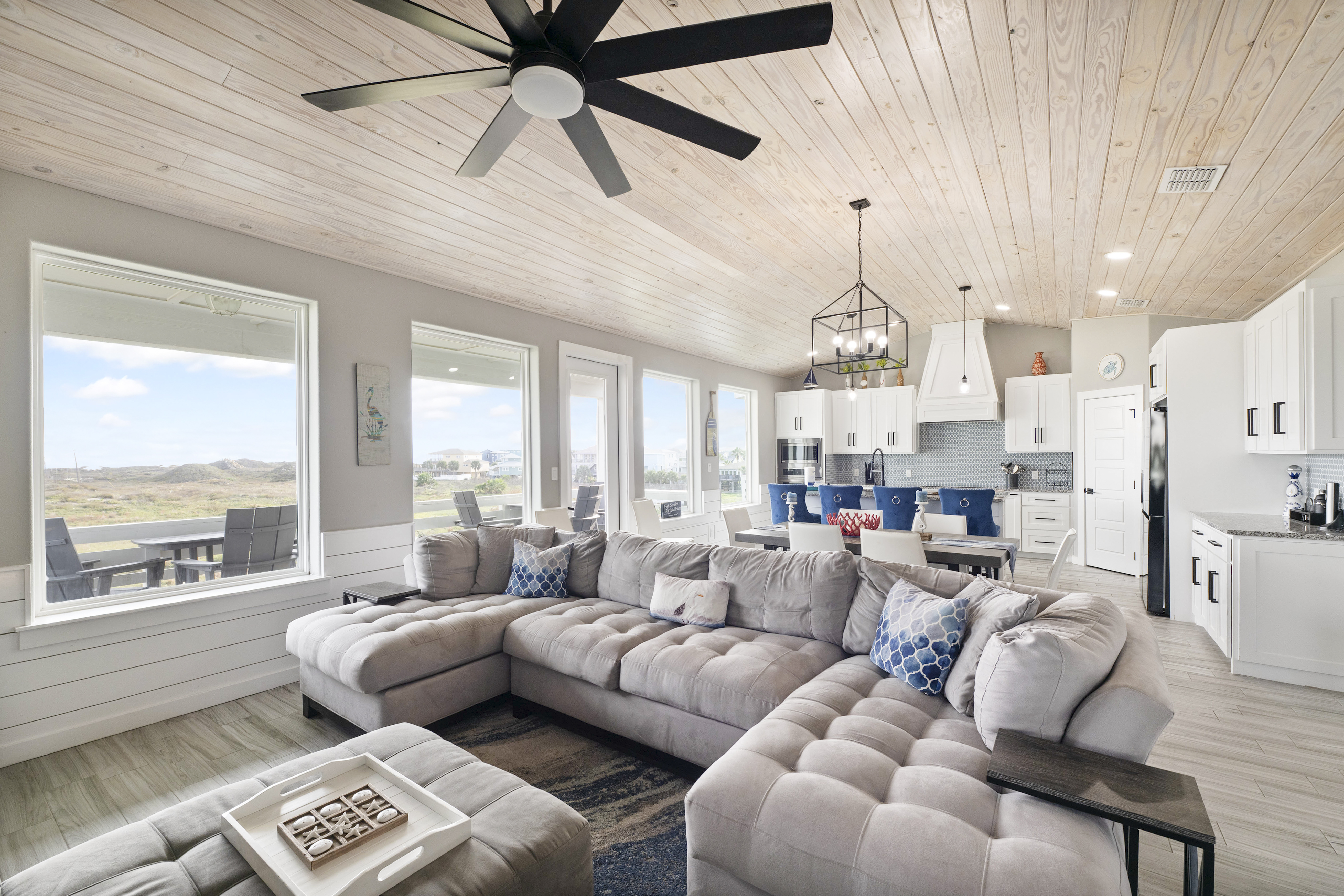 Embrace the open floor plan of this island retreat, featuring views of the dunes with the Gulf just beyond.