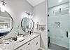 Enjoy the luxury of a double vanity paired with a spacious walk-in shower.