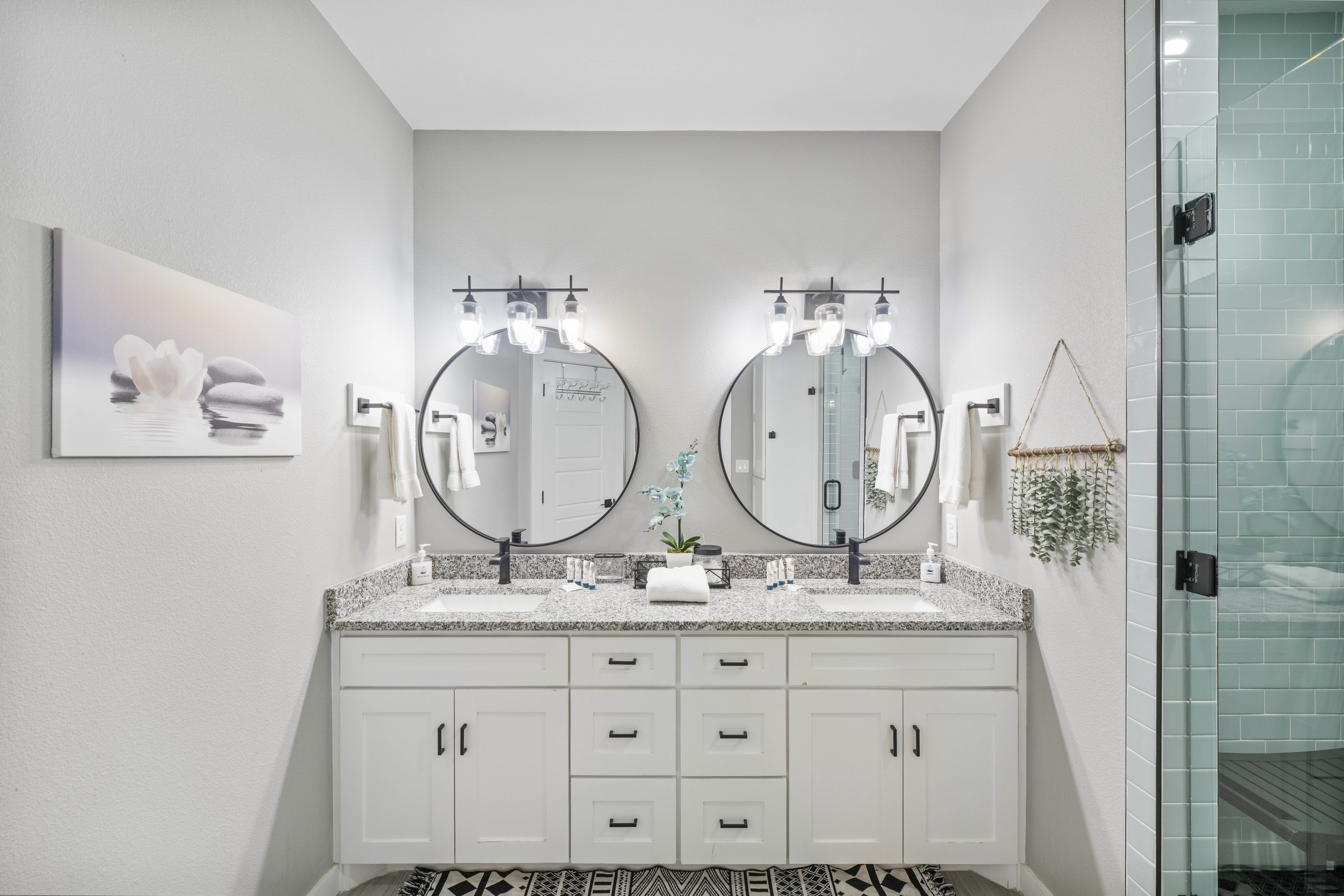 Indulge in a luxurious double vanity and walk-in shower experience.
