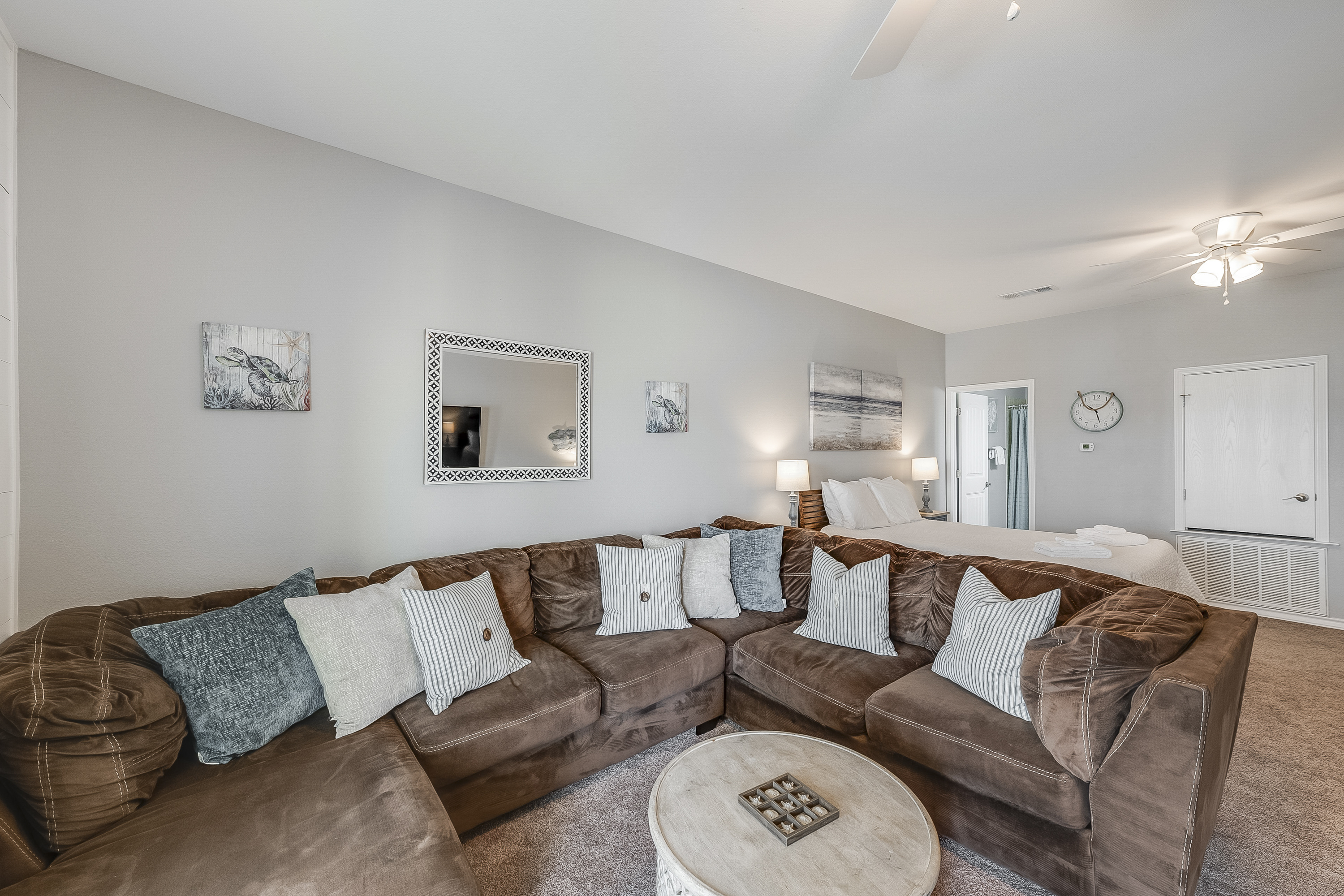 Bonus room with large sectional and queen size bed.