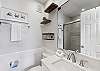 Stylish bathroom boasting a sleek toilet and contemporary sink with ample counter space 