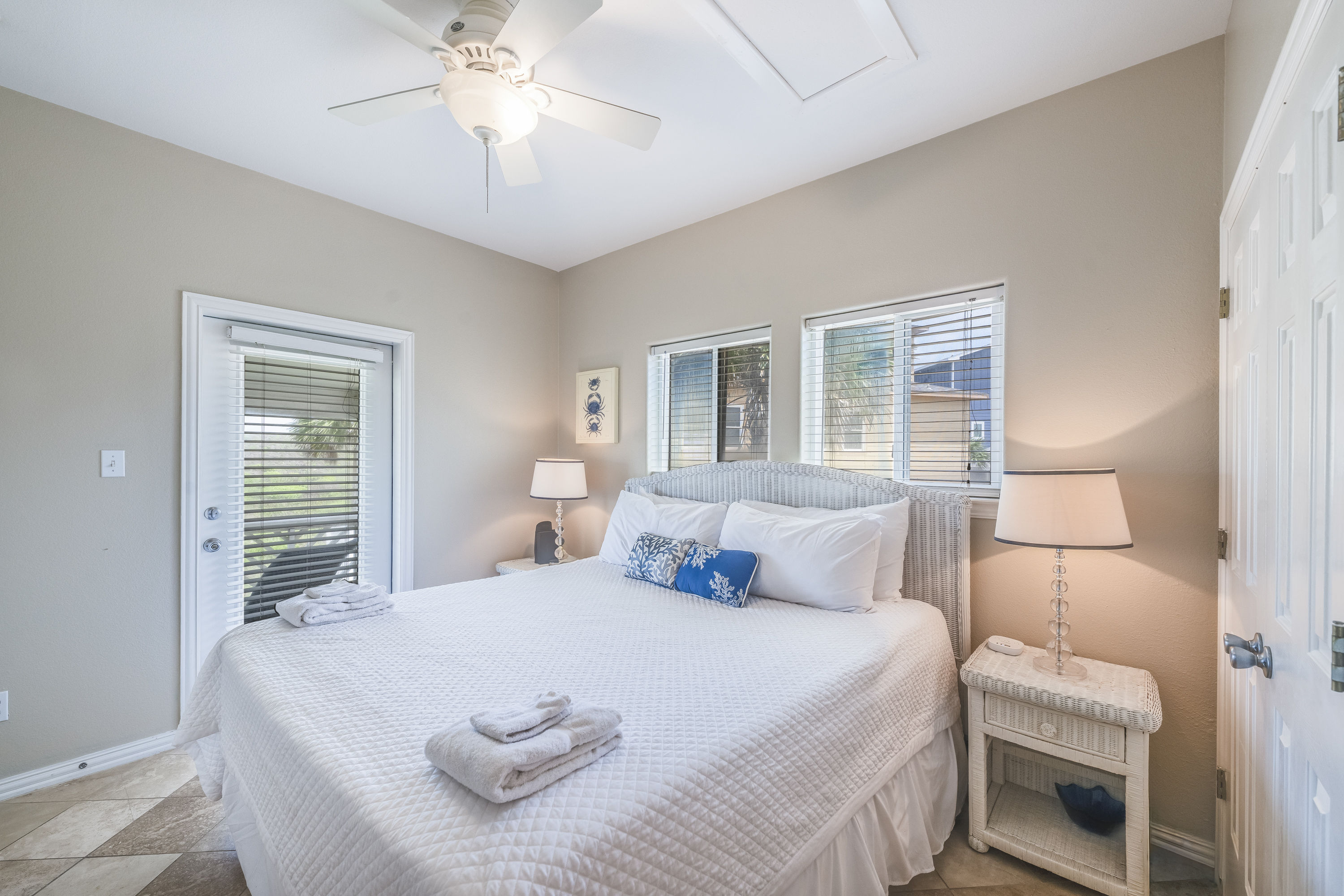 Patio access from your second-floor King Suite invites you to relax and savor the coastal breeze