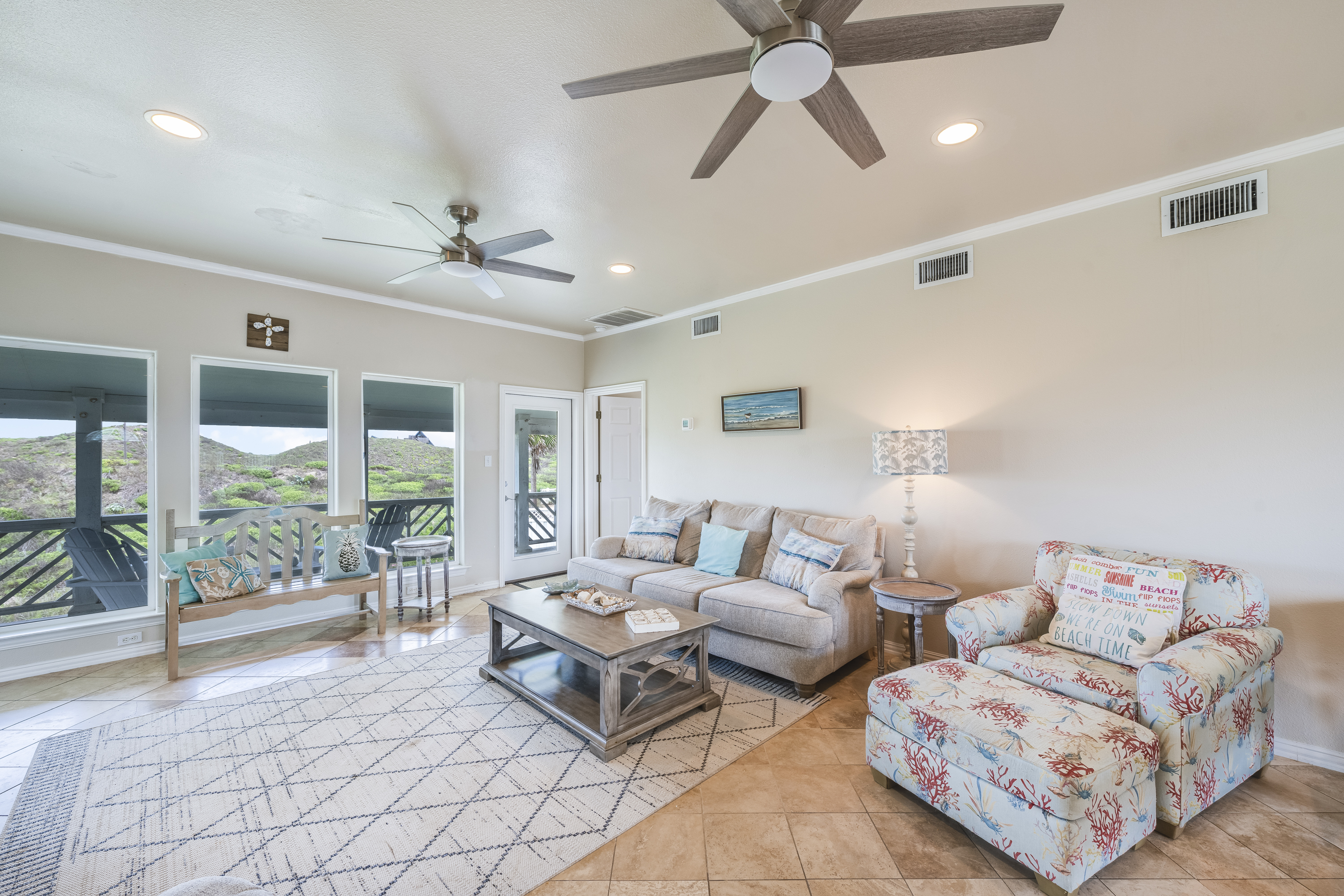 Soft, comfortable seating, and ocean-inspired details create a welcoming space perfect for unwinding after a day by the shore.