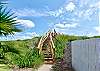 The pedestrian boardwalk to the beach from the subdivision is only feet away!