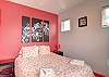 This 4th bedroom is pretty in pink and also boasts a Queen size bed 