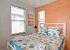 Bright as a melon this sweet 3rd bedroom also offers a Queen size bed. 