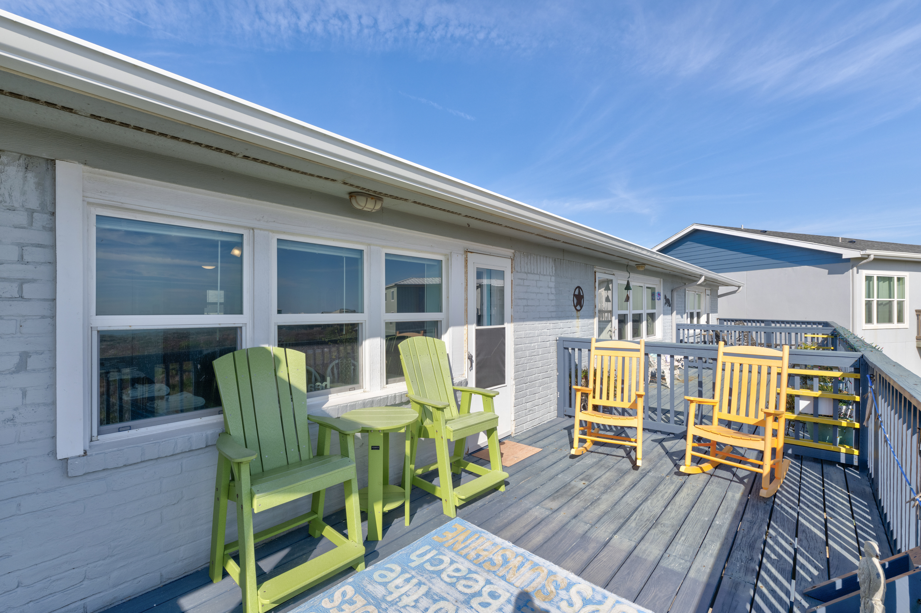 This coastal deck is perfectly furnished for carefree fun and laid-back relaxation.