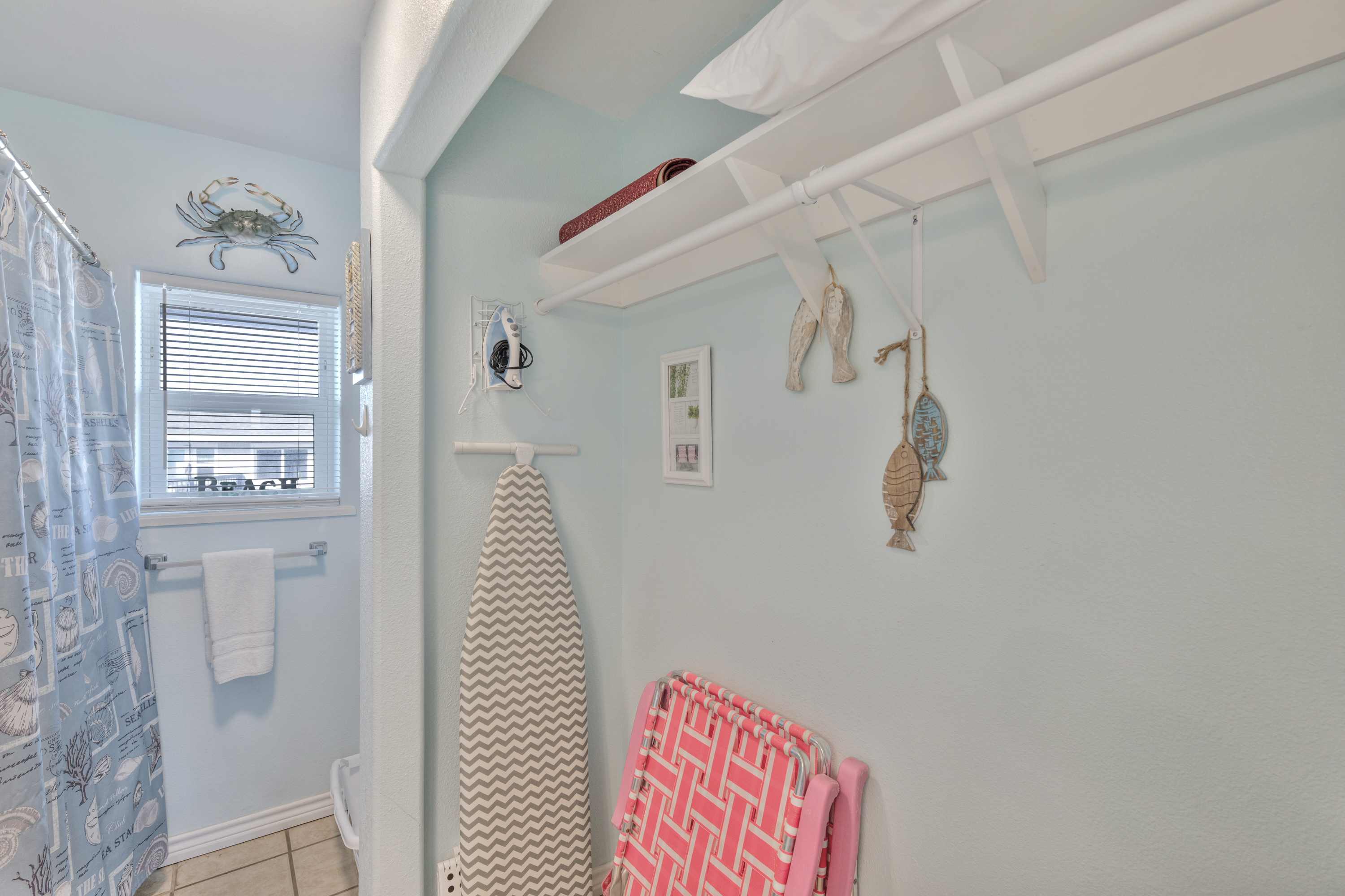 Enjoy a full bath with built-in unpacking space and the added convenience of an iron and ironing board — perfect after beach adventures.