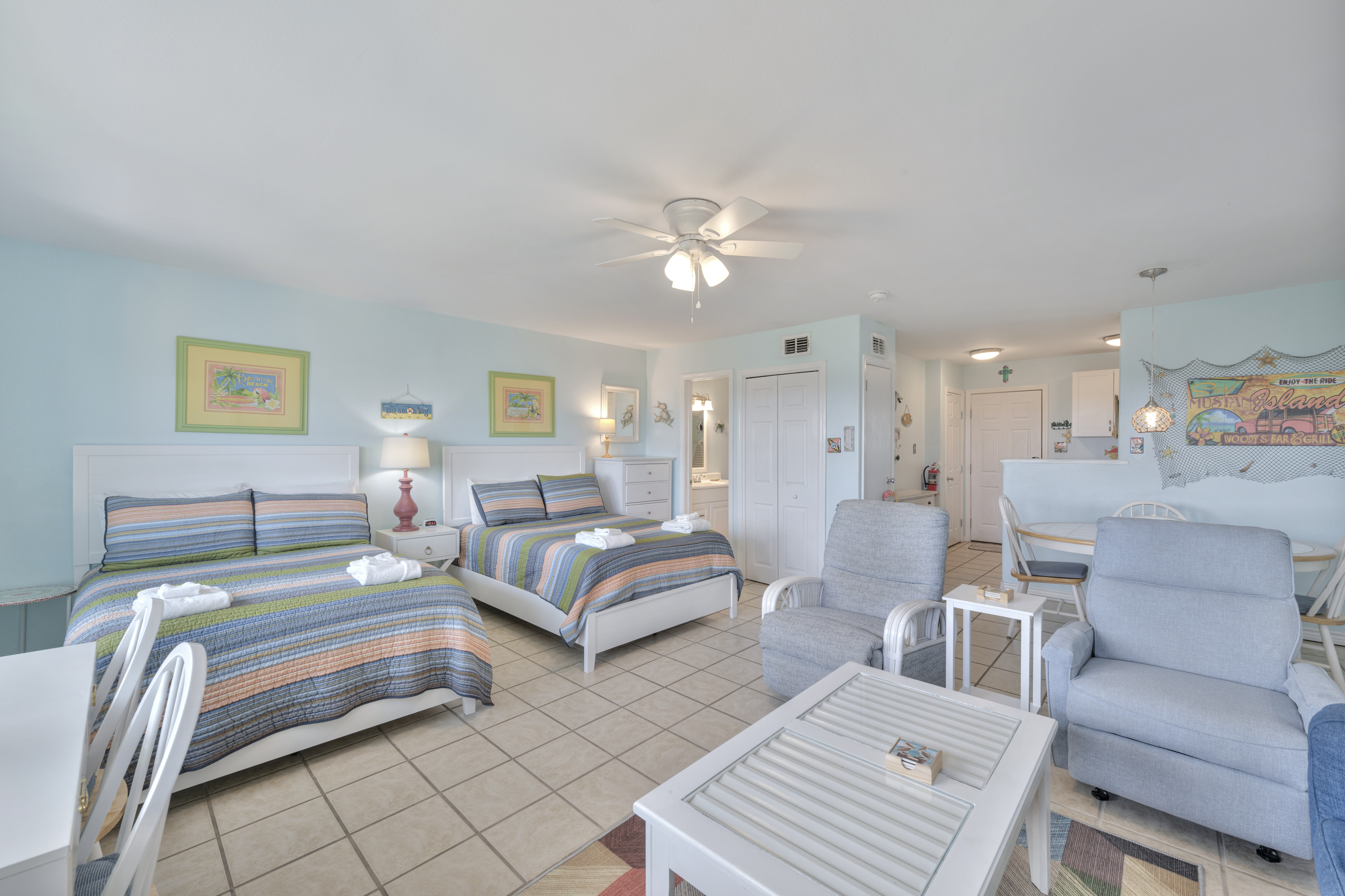 The kitchen, dining, and living areas blend seamlessly for a bright and airy feel