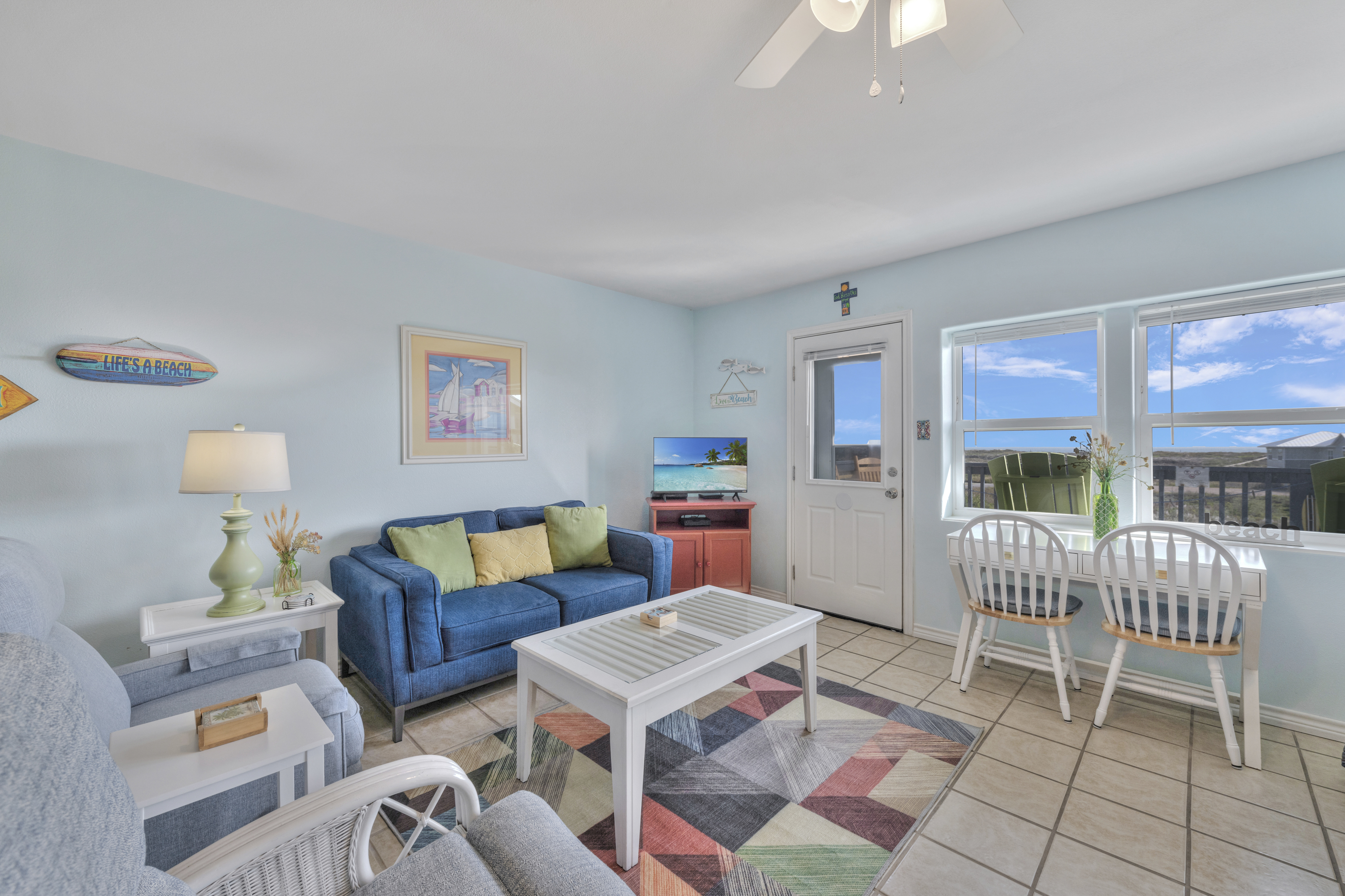 This bright, coastal-inspired living area beautifully captures a relaxed beachside feel.