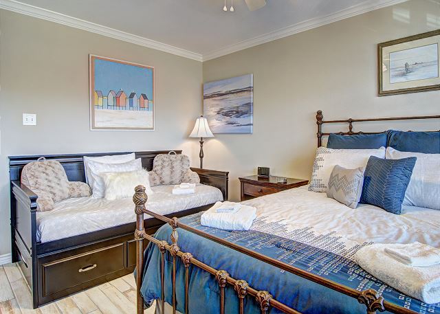 Master bedroom with queen and twin bed with trundle