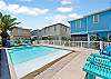 Sparkling community pool with beach-style entry  